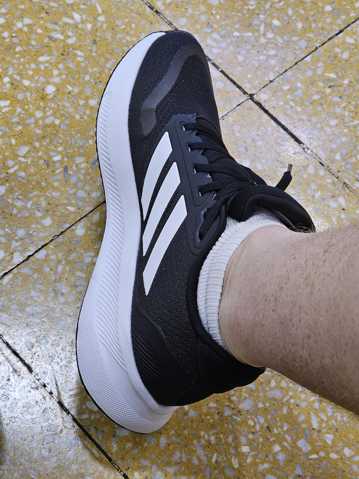 Adidas Run Falcon 5 lifestyle shot showing versatility for casual wear