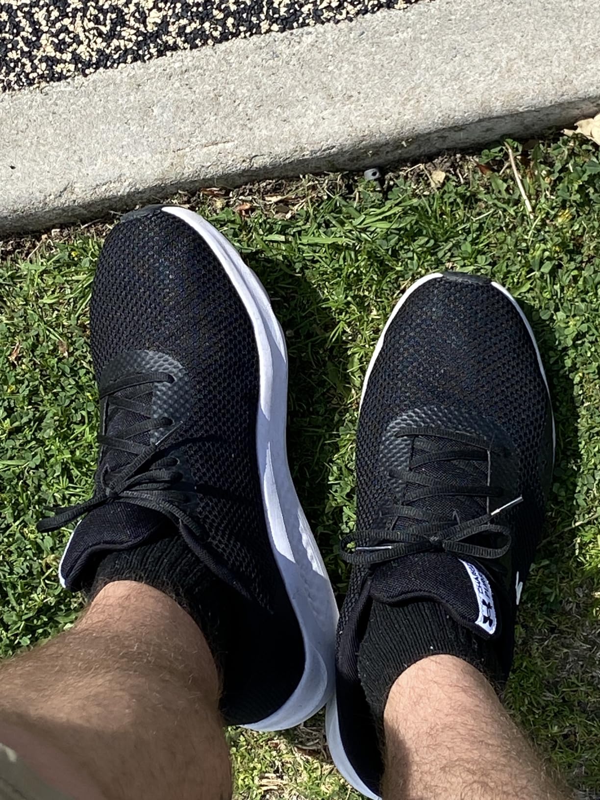 Detailed view of Under Armour Charged Pursuit 3 showing mesh upper construction and synthetic overlays
