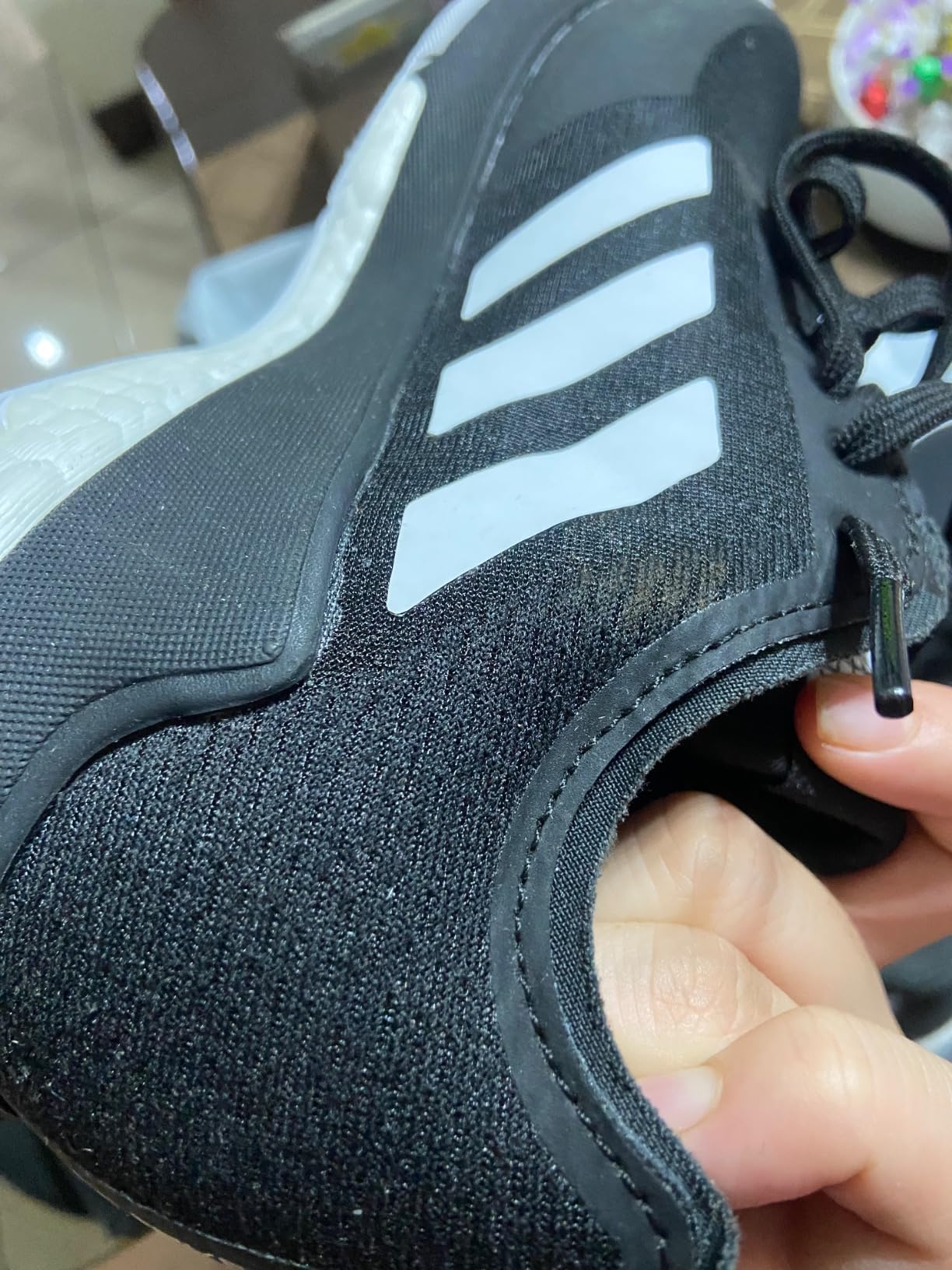 Adidas Crazyflight volleyball shoes detail shot showing mesh upper construction and three stripes design