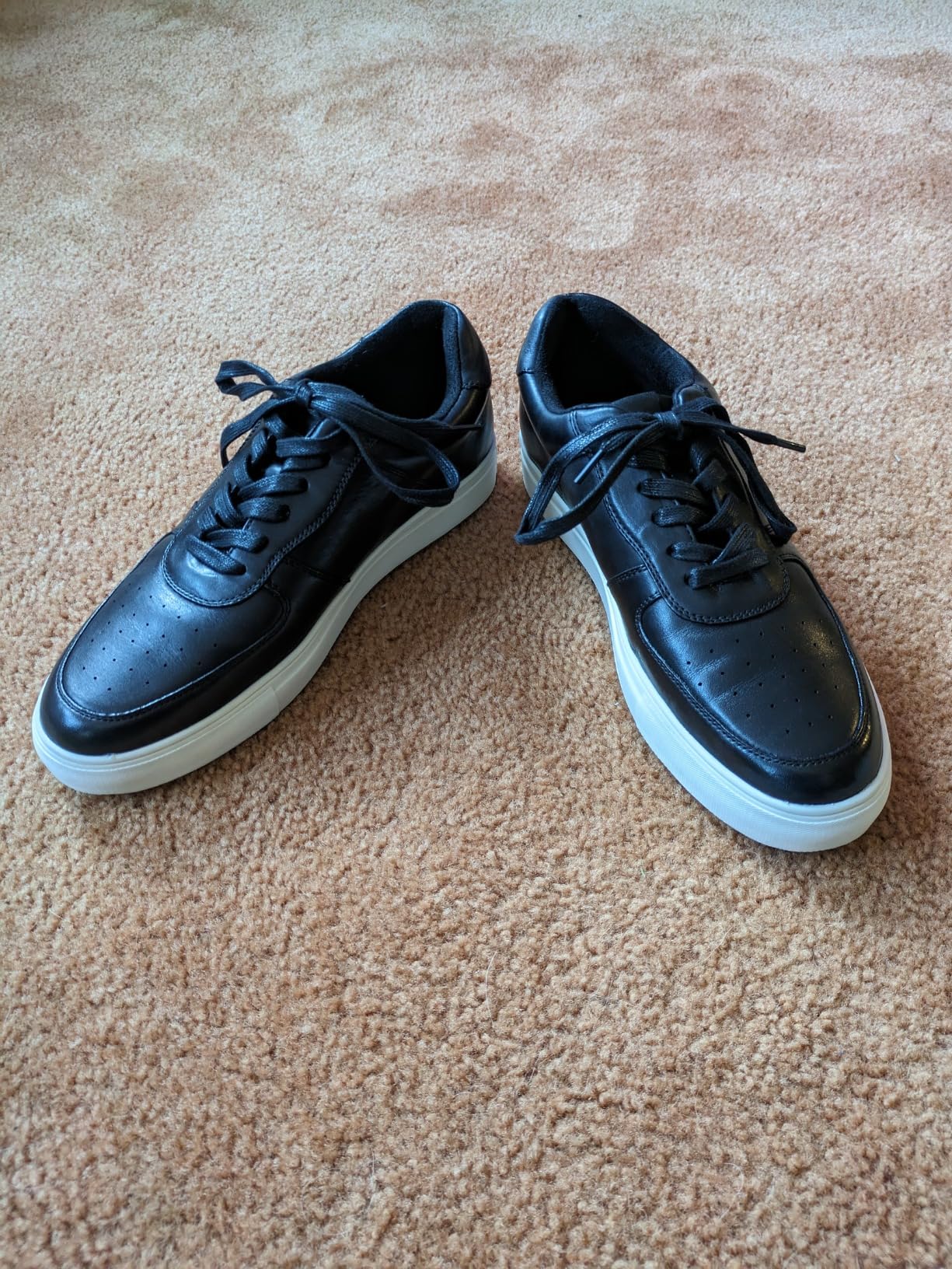 Side profile view of Jousen mens dress sneaker showing sleek silhouette and oxford lacing system