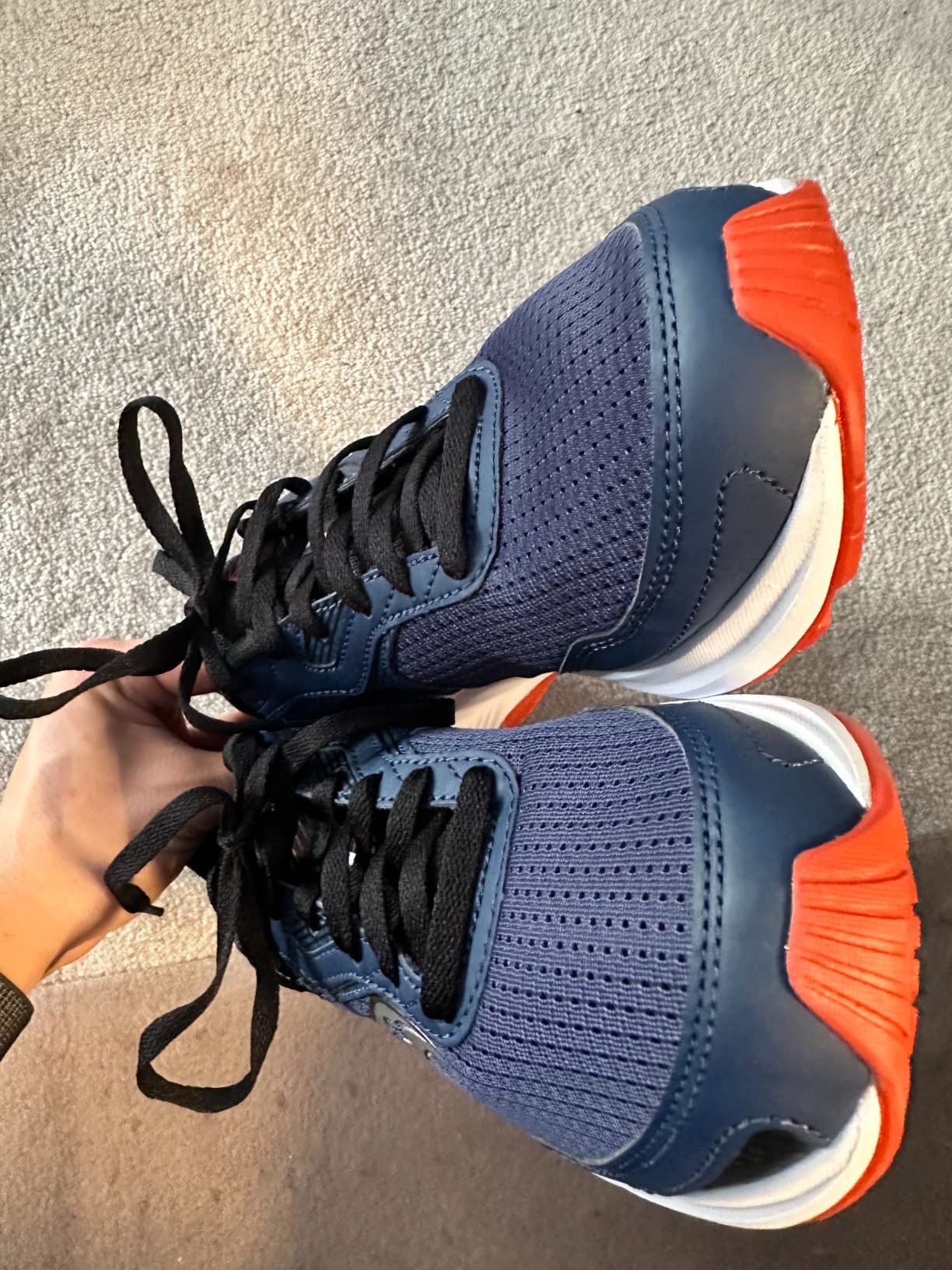 Bottom view of Saucony Cohesion 16 showing rubber outsole tread pattern and wear resistance