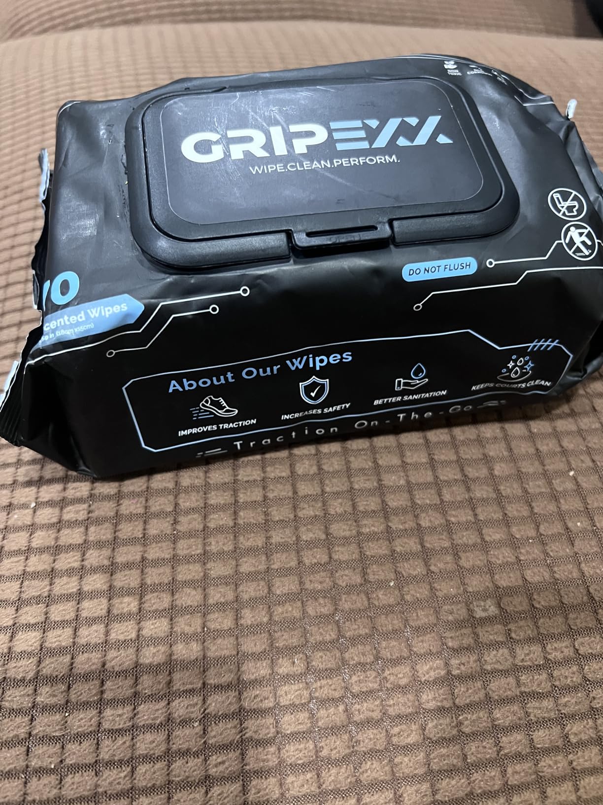 Various shoes types cleaned with GRIPEXX wipes including basketball, running, and casual shoes