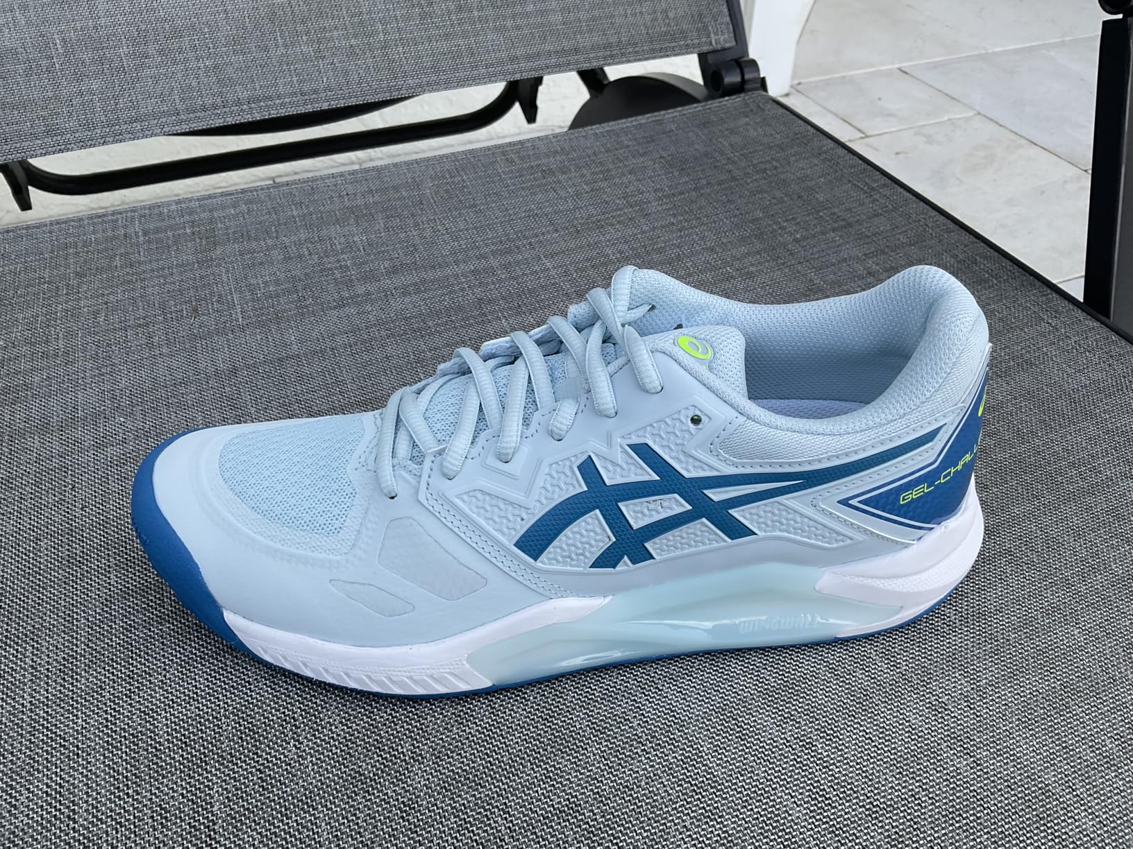 Asics Gel-Challenger 13 on court action shot showing lateral movement support during tennis play