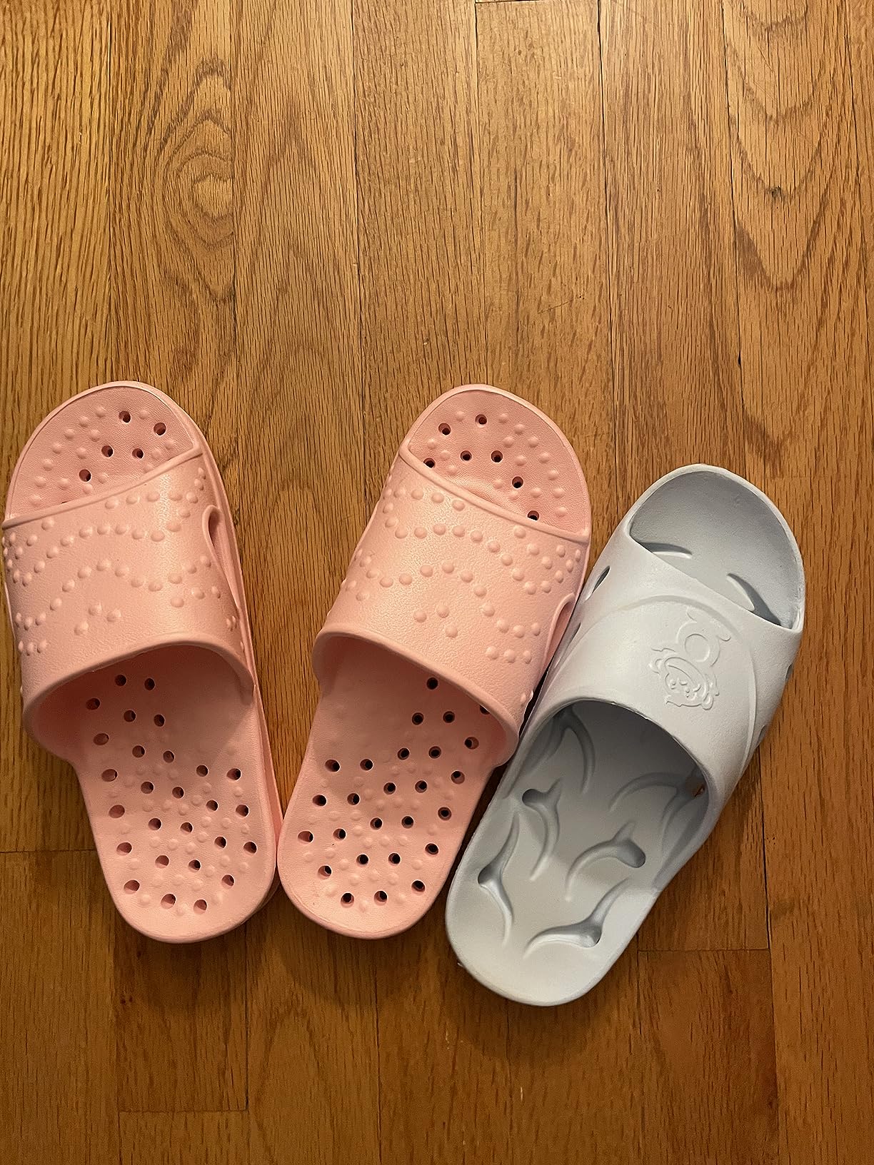 Bottom view of shevalues shower shoes showing drain holes and textured sole pattern