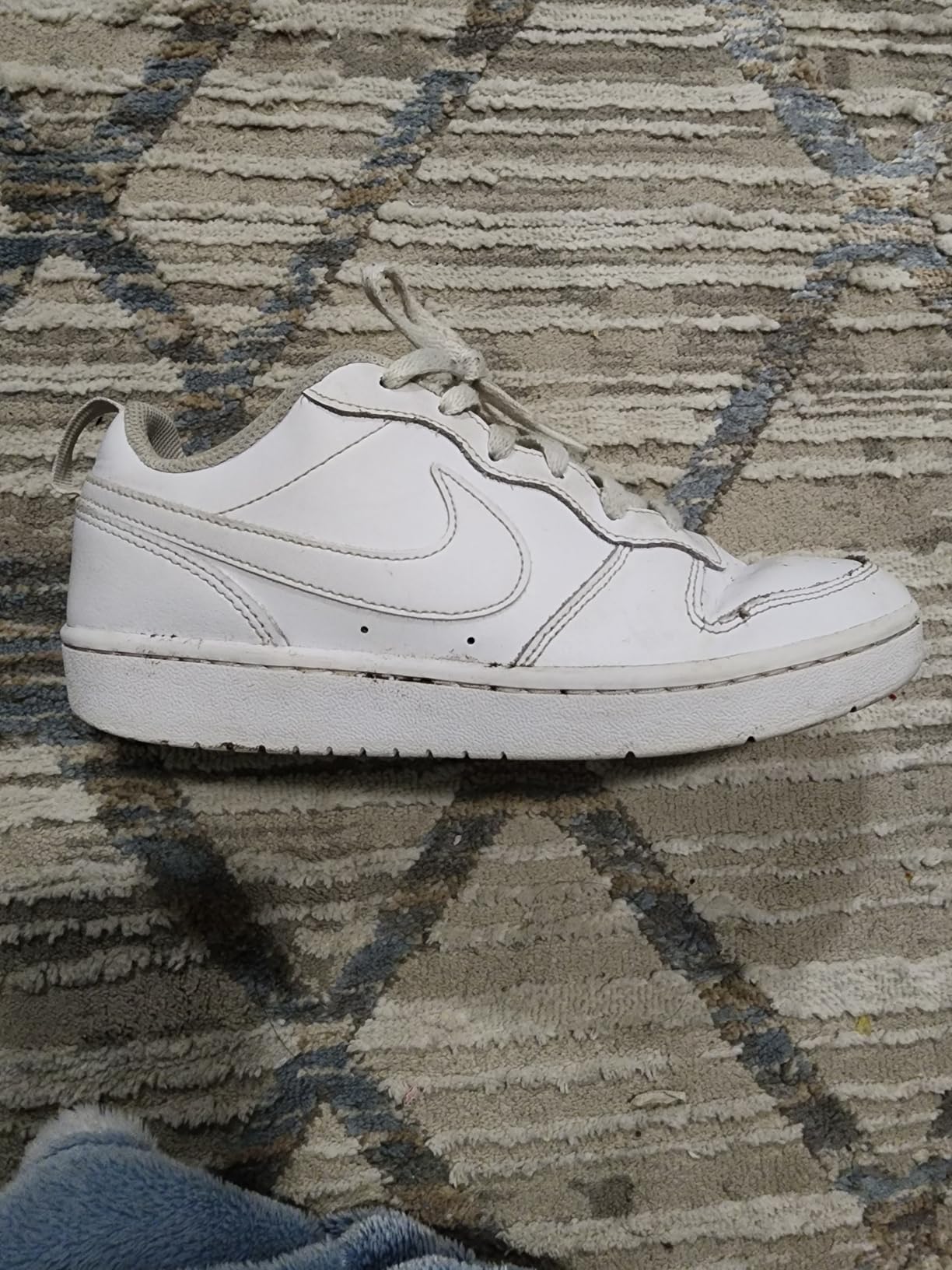 Detailed view of sole wear pattern showing areas of heaviest use after daily wear
