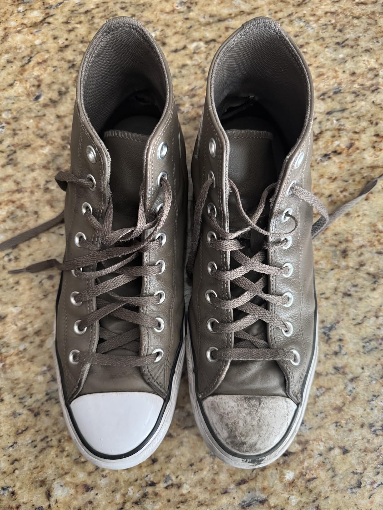 Final comparison showing collection of cleaned sneakers demonstrating SneakERASERS effectiveness