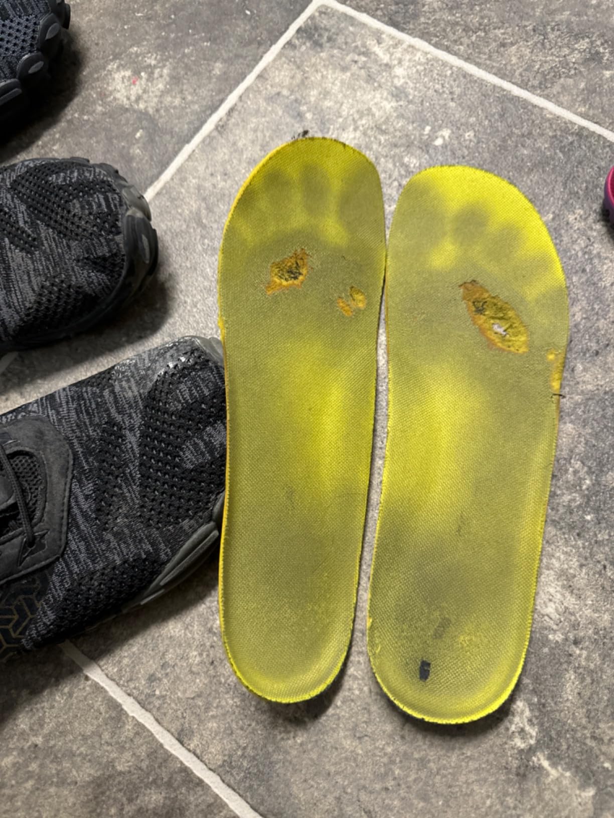 WHITIN shoes on trail showing tread pattern performance on dirt and rock surfaces