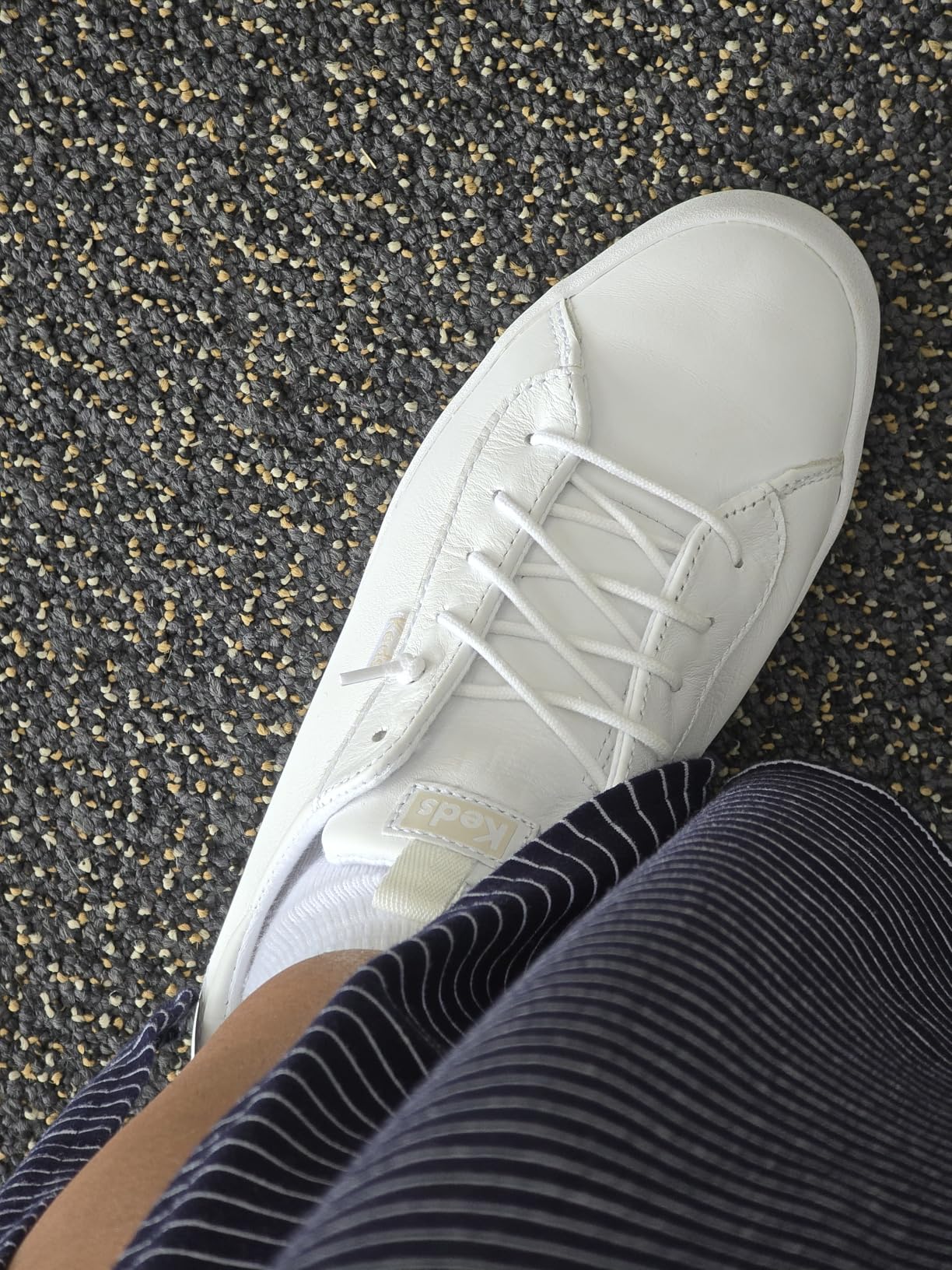 Side view of Keds Kickback showing low-profile silhouette and canvas upper construction