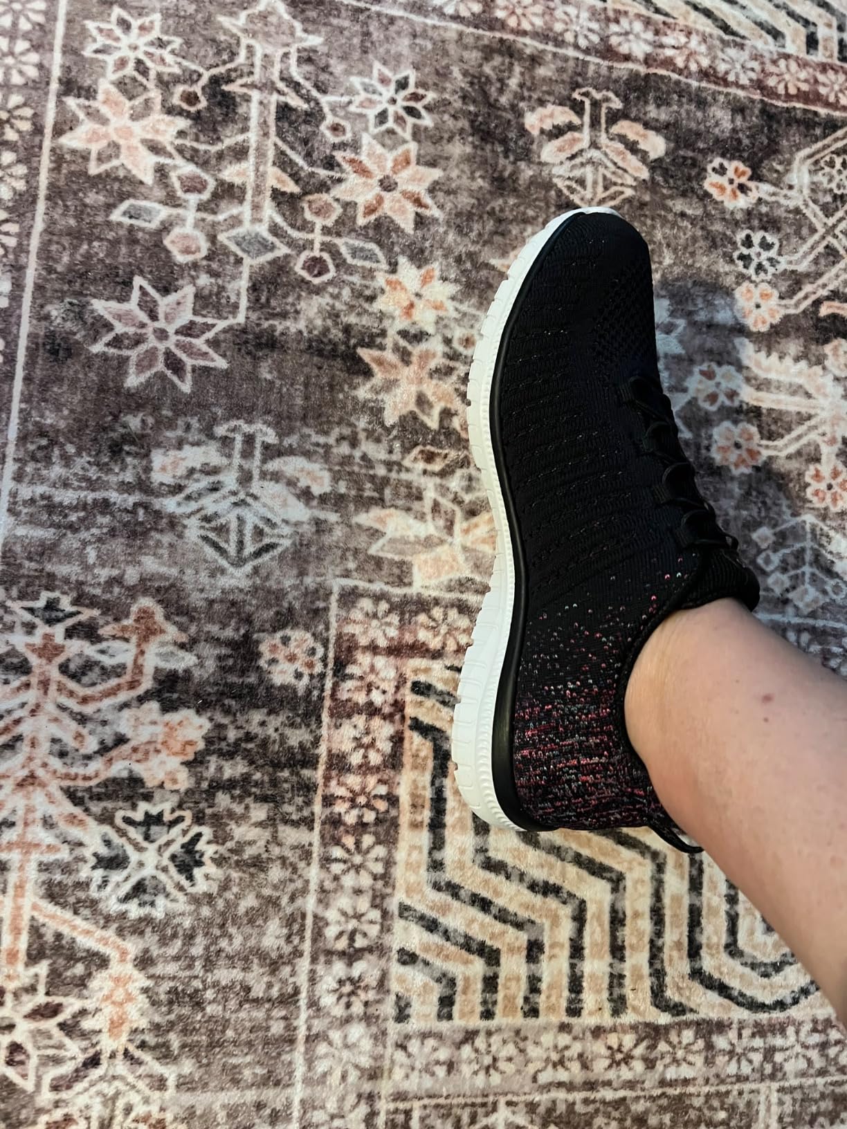 Lifestyle shot of Skechers Virtue sneakers in real-world casual setting