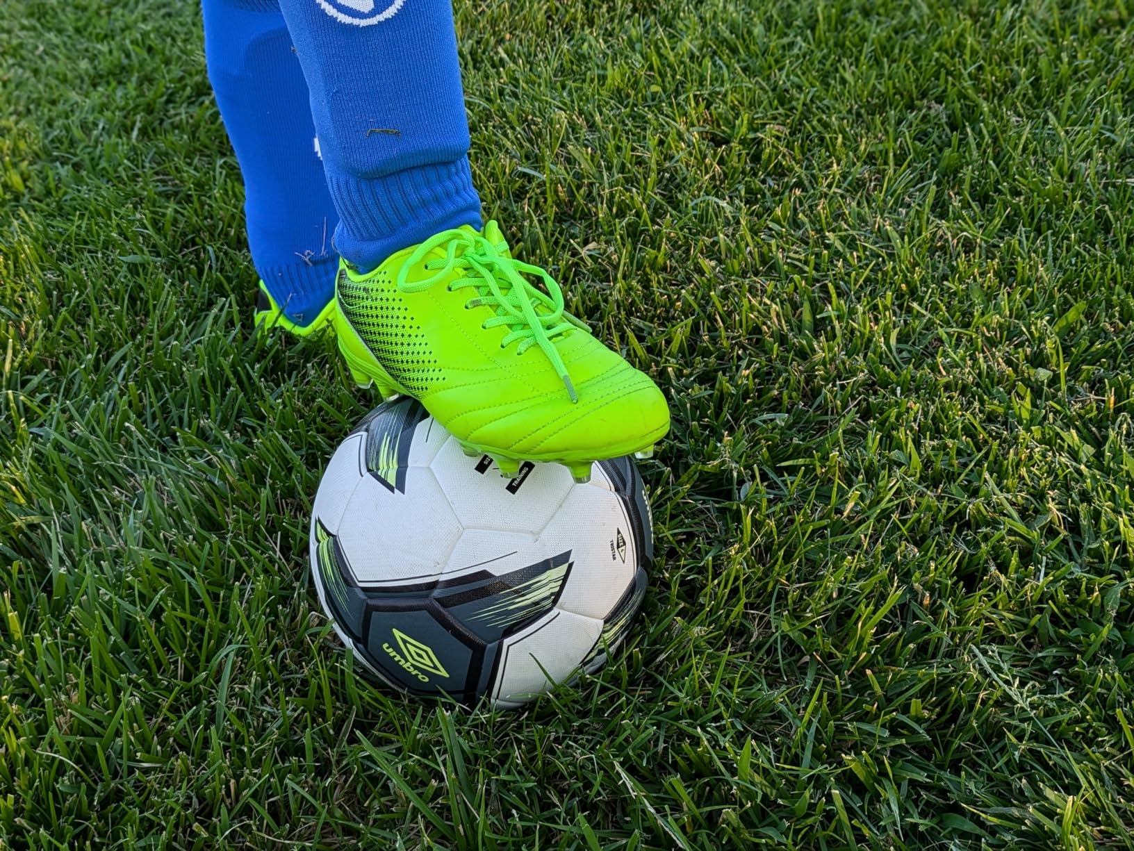 LIZRHA soccer cleats detail shot showing synthetic upper construction and lace-up closure system