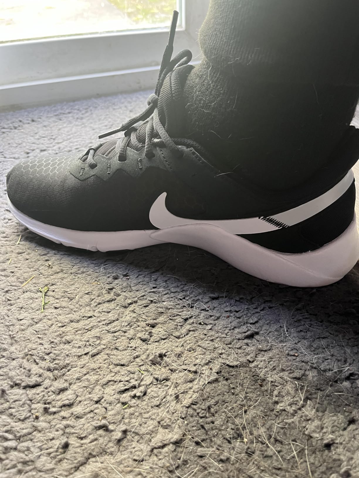 Nike training shoes design detail showing synthetic upper construction and ventilation mesh panels