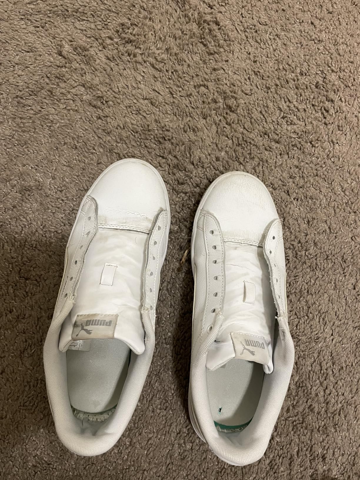 Before and after comparison showing dramatically cleaner white sneaker after using SneakERASERS