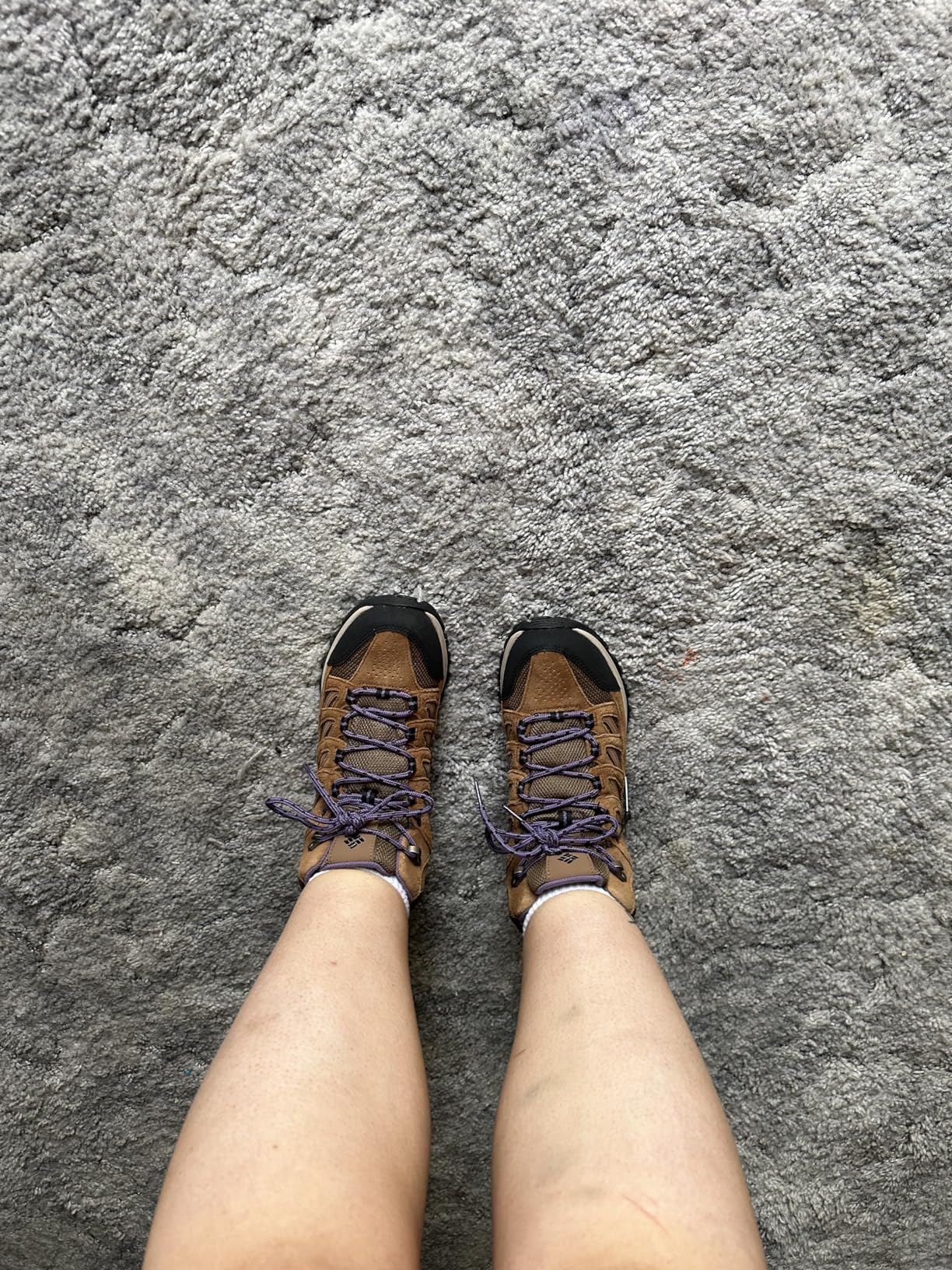 Columbia Crestwood boots in action on rocky hiking trail showing grip and ankle support