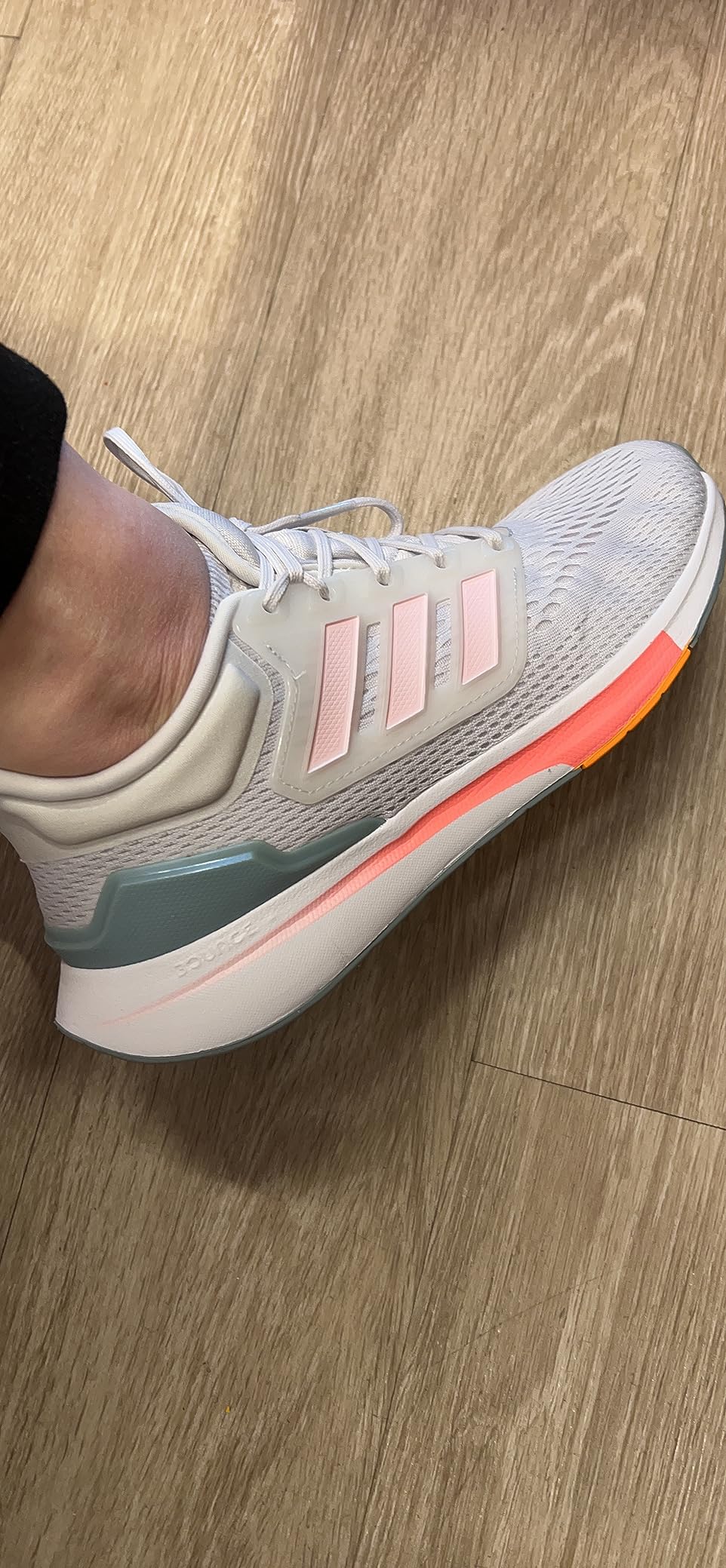 Close-up view of adidas Eq21 engineered mesh upper showing breathable construction and TPU support elements