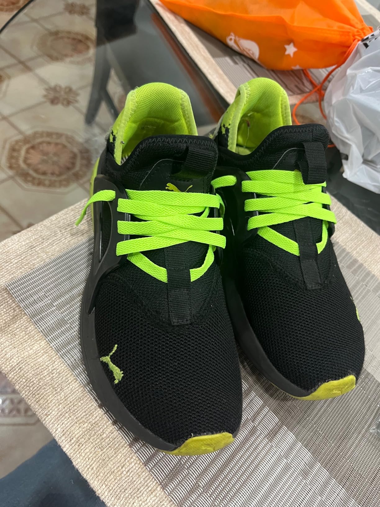Before and after comparison showing old worn laces versus fresh UpUGo replacement laces on sneakers
