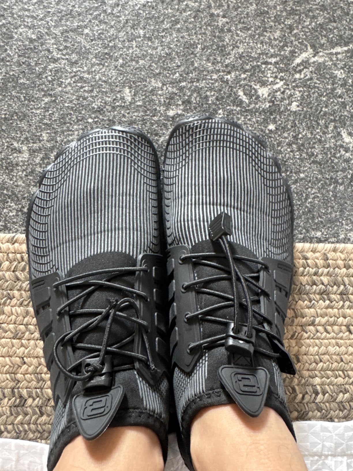 Water shoes sole pattern showing drainage holes and grip texture for wet surfaces