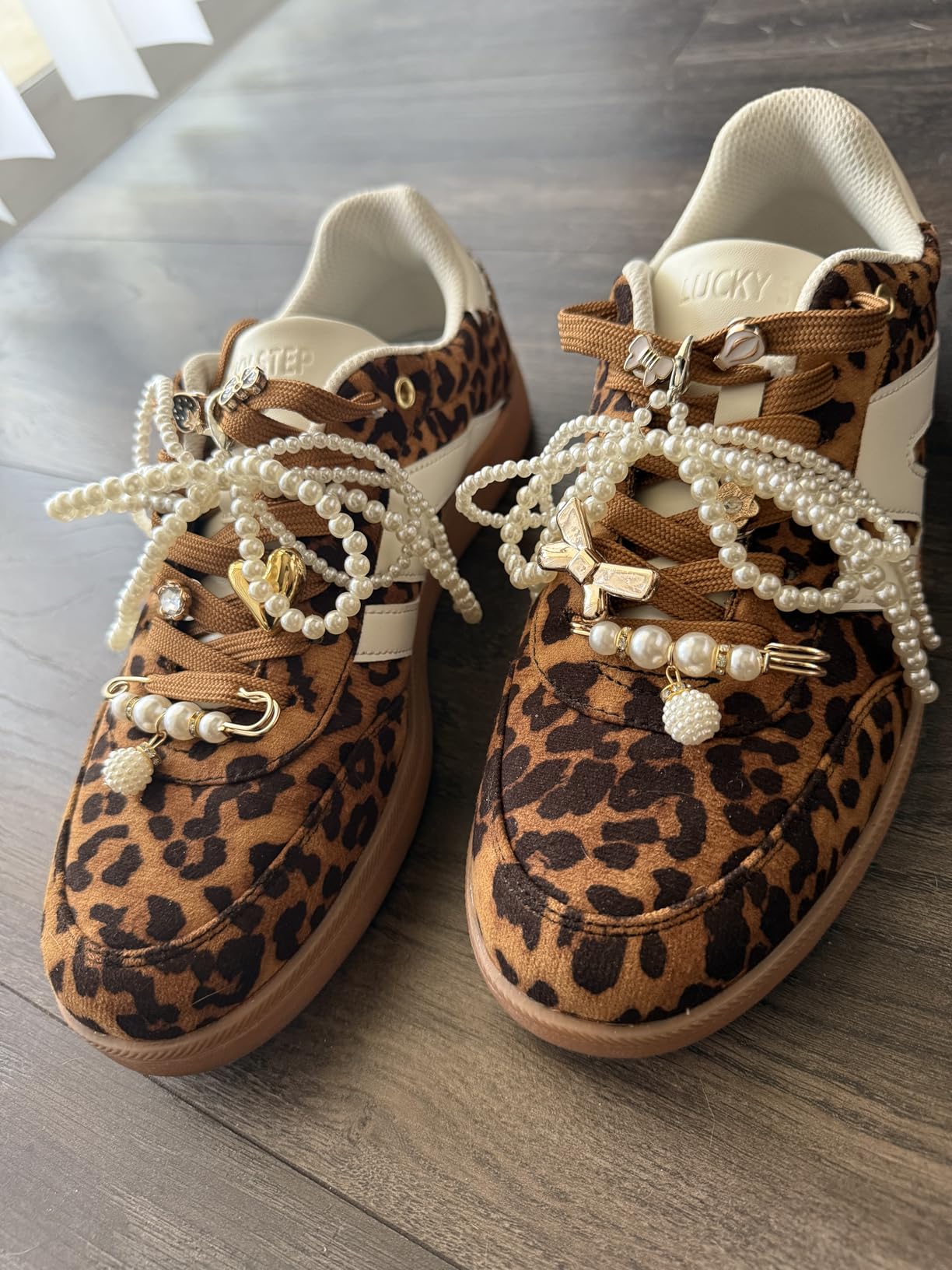 LUCKY STEP sneakers with decorative charms showing customization potential
