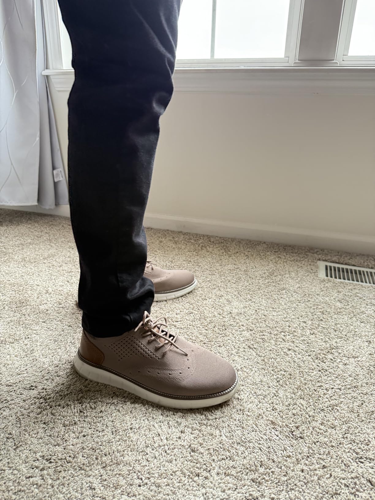 Side profile of SVNKE dress oxford showing athletic-inspired sole design and overall silhouette
