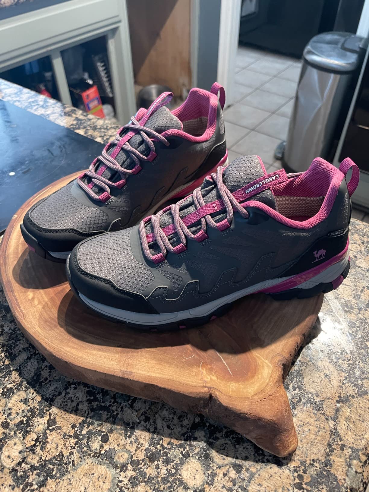 CAMELSPORTS hiking shoes in wet conditions showing waterproof performance during stream crossing