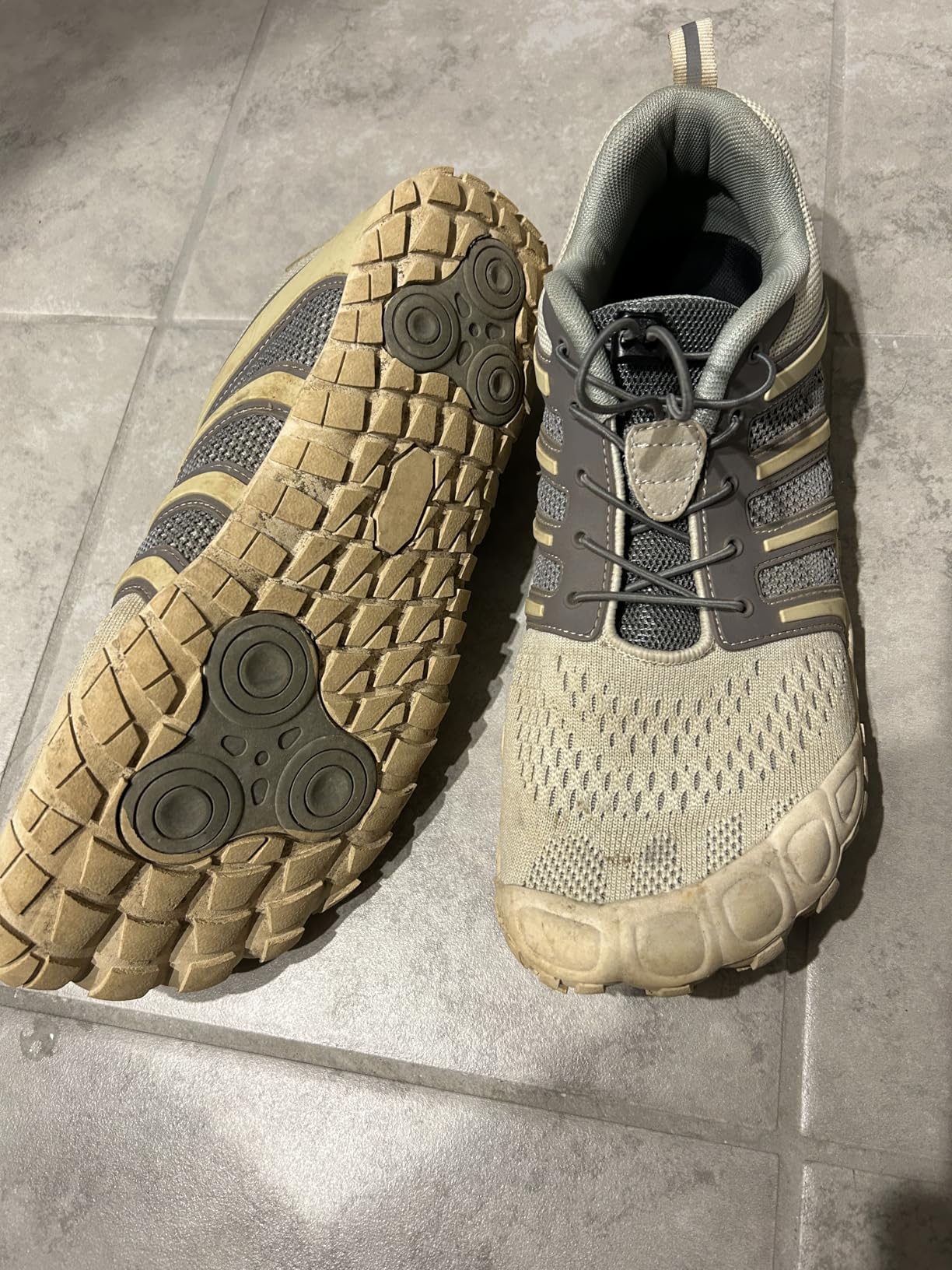 Sole view showing aggressive tread pattern and cushioned heel design for cross-training activities