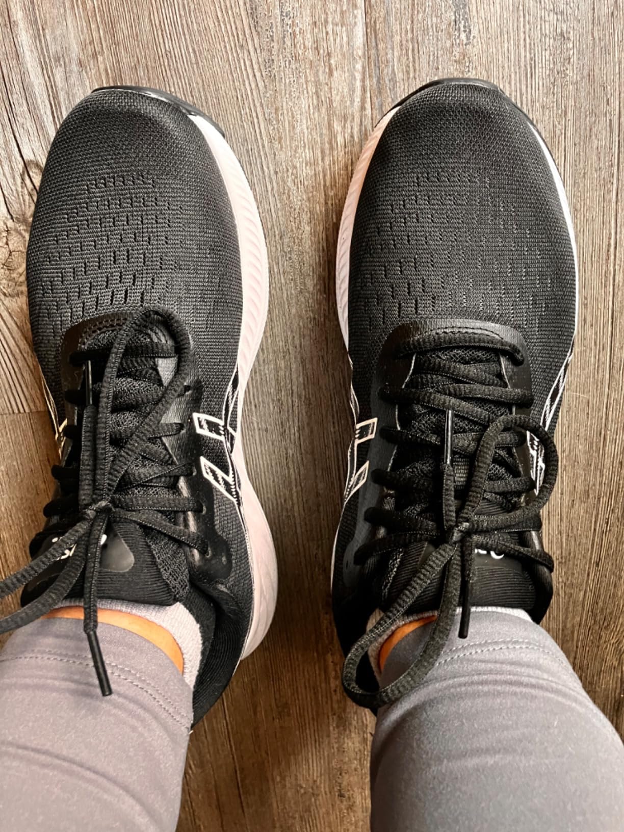 Close-up view of ASICS Gel-Excite 9 showing engineered mesh upper construction and heel design