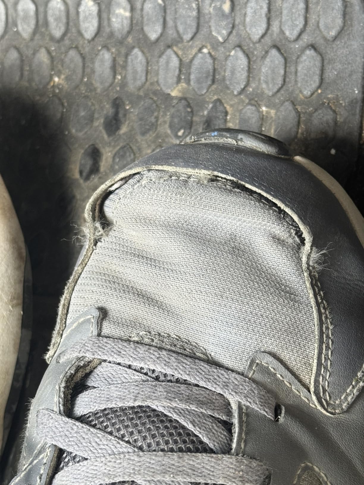 Under Armour Charged Edge sneaker side profile showing breathable mesh upper construction and leather overlays