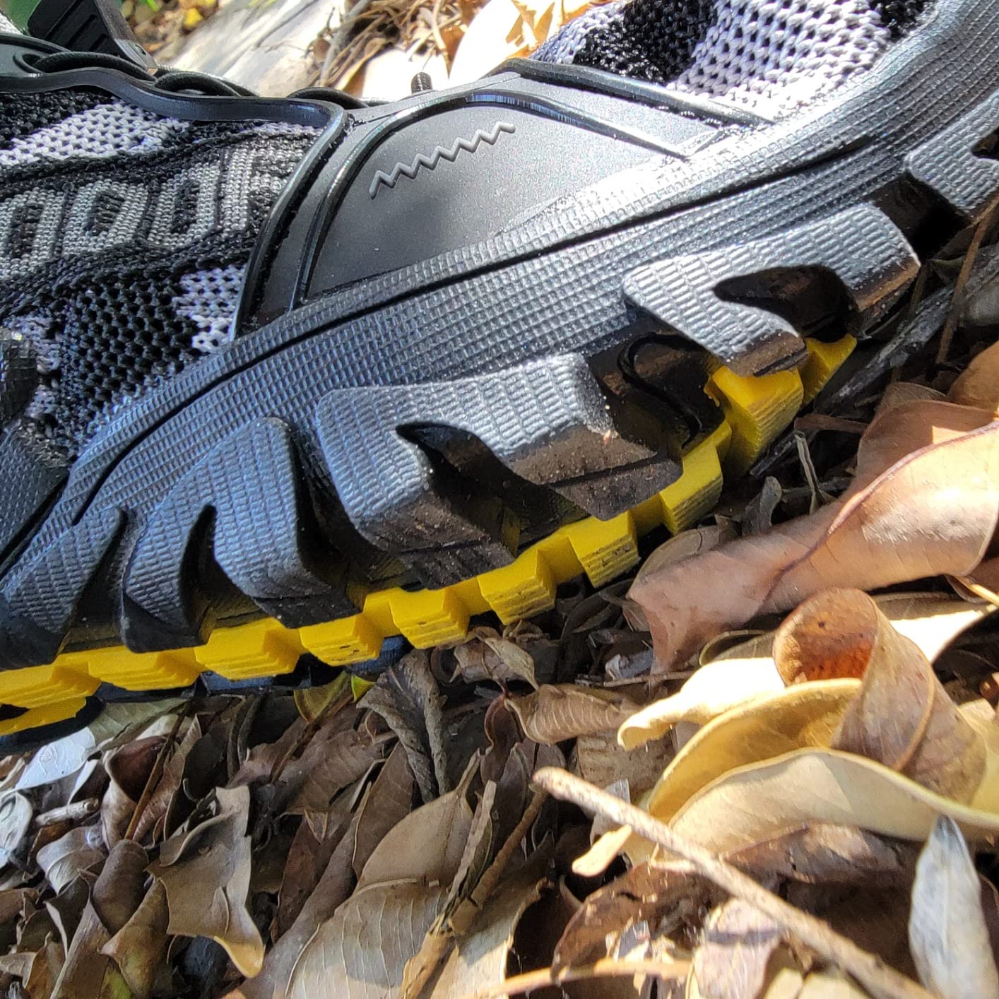 Bottom sole view of TANGYUGEN water shoes displaying the anti-slip rubber tread pattern