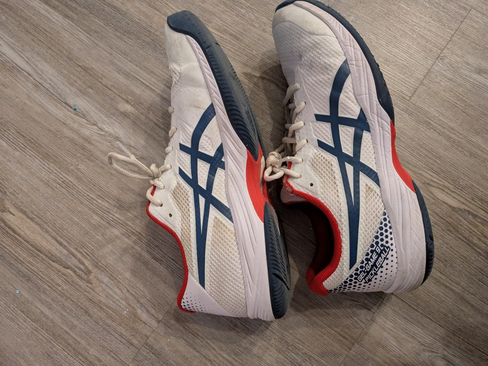 Asics Gel-Game 9 side profile showing mesh upper and court shoe design details