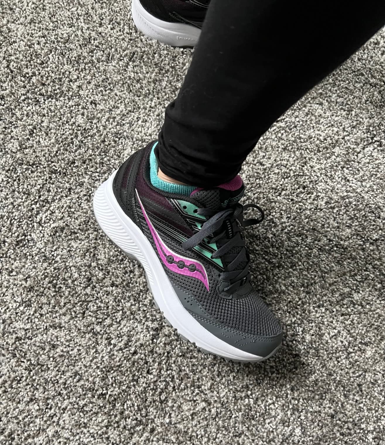 Saucony Cohesion 15 showing lightweight design and overall aesthetic appeal for women's running