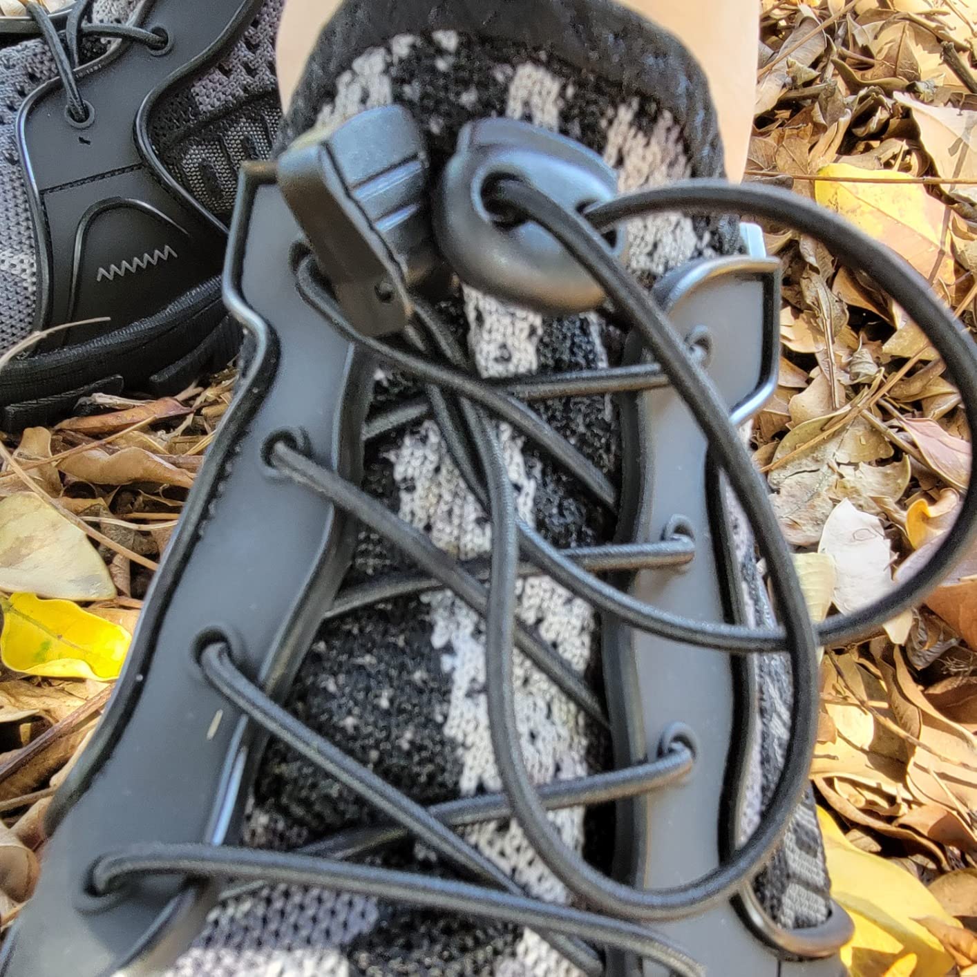 TANGYUGEN water shoes being worn outdoors showing real-world usage and fit on feet