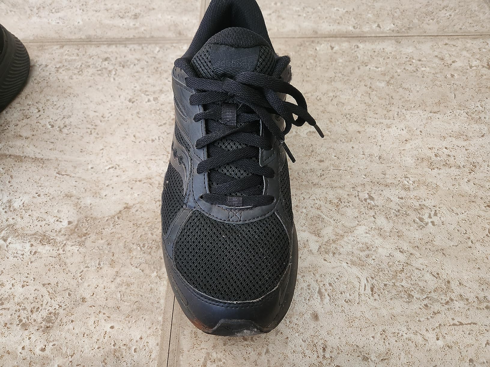 Saucony Cohesion 14 Trail heel and ankle support detail showing protective overlays and collar padding