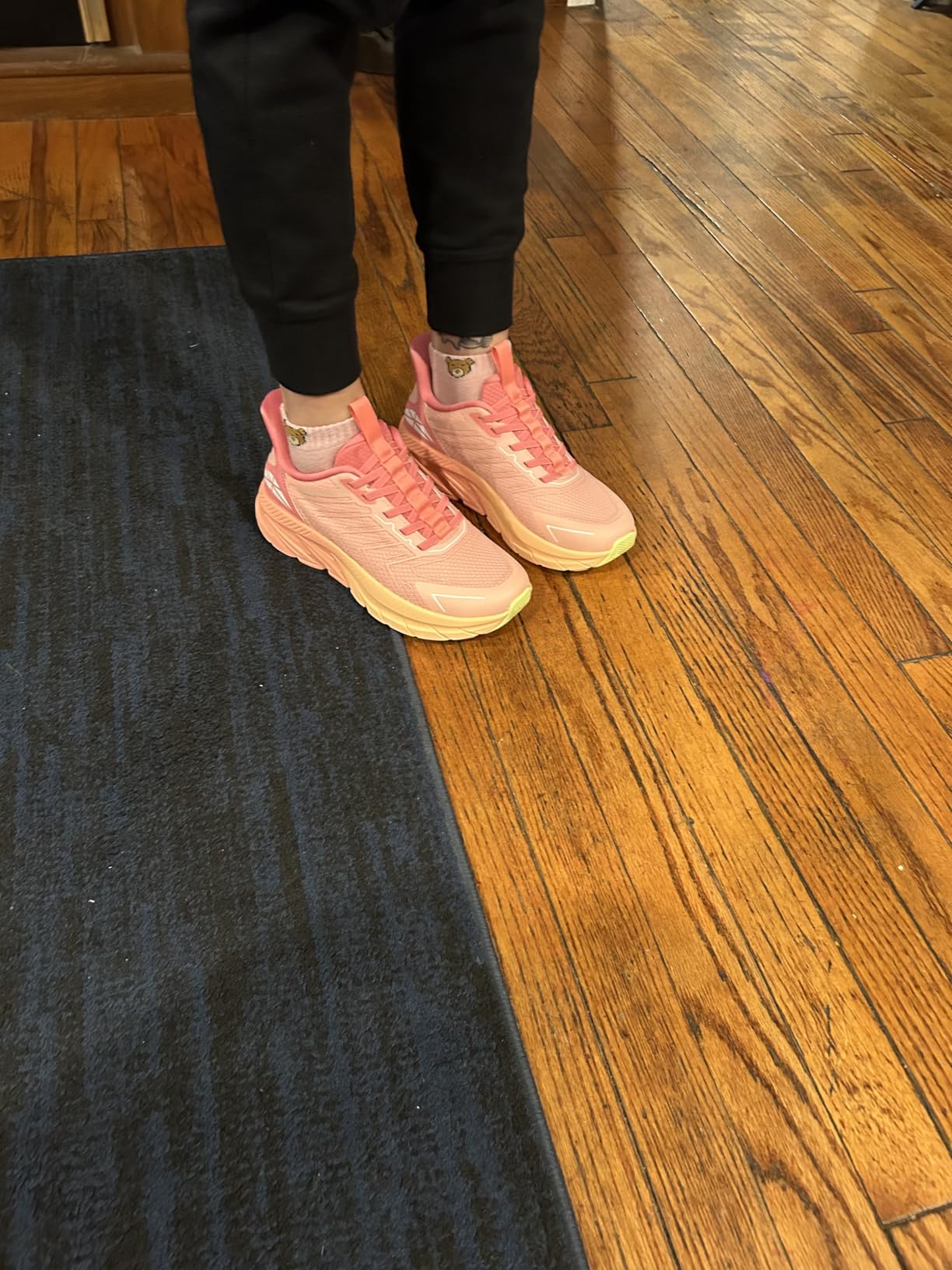 Different colorway options of slip-on sneakers showing beige upper with green and blue sole accents