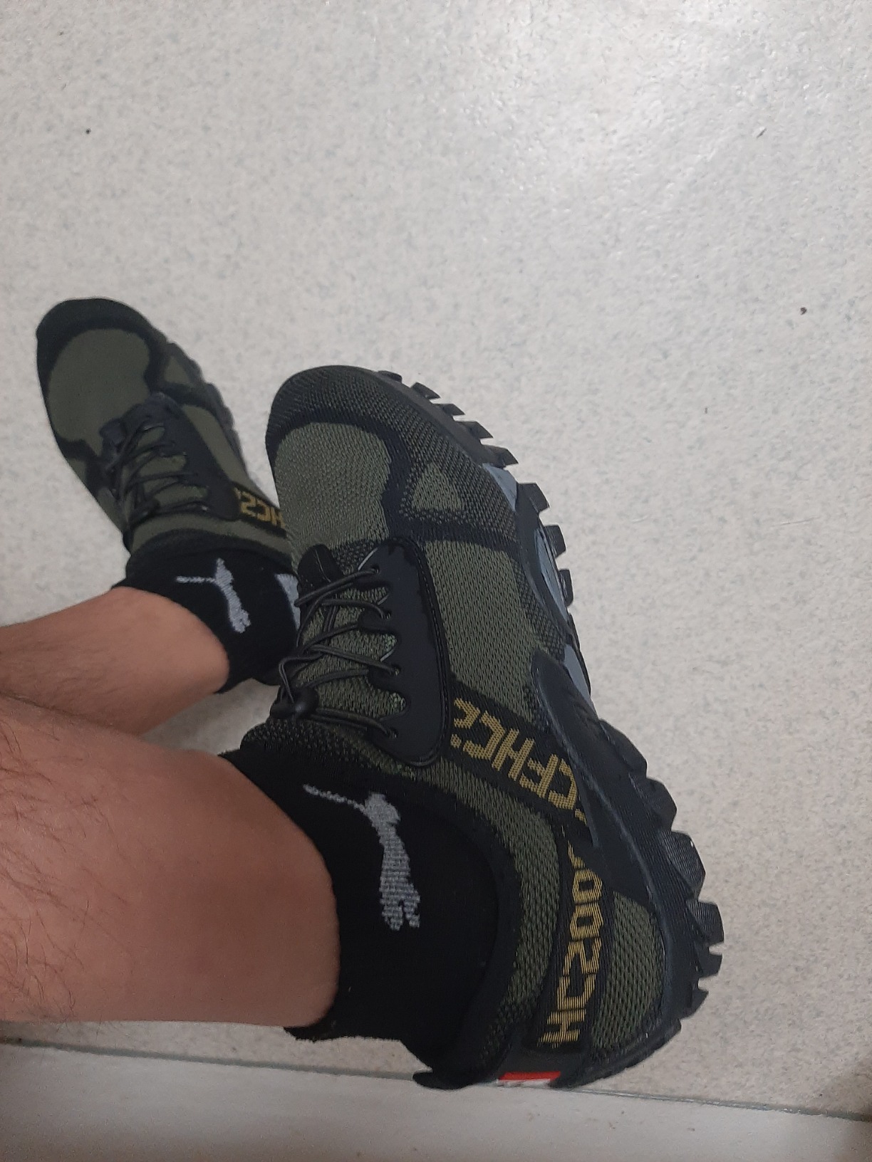 ABAO hiking shoes on rocky terrain demonstrating grip and traction capabilities