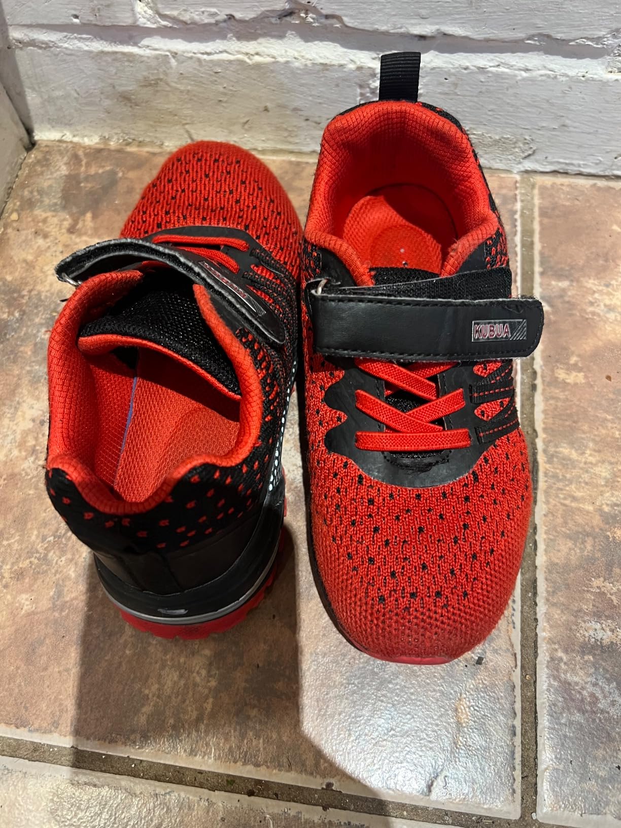 KUBUA kids sneakers worn during playground activities showing traction and durability