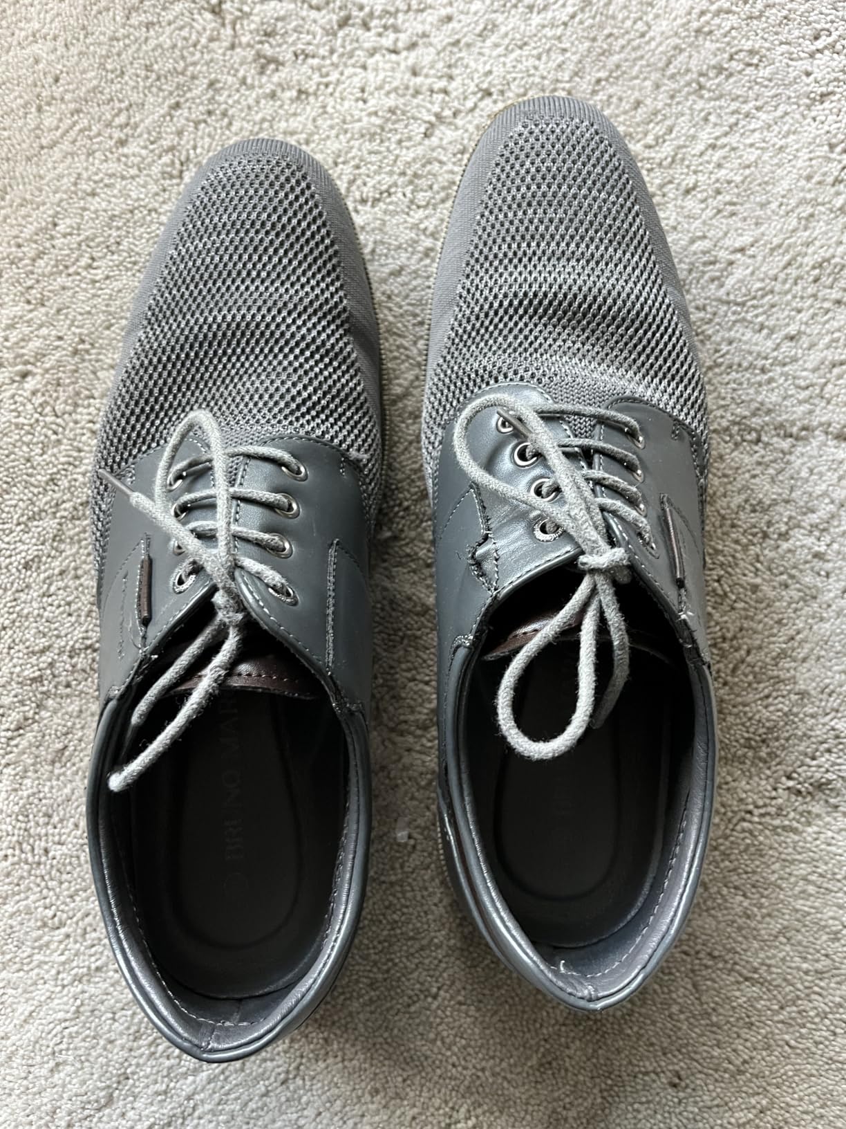 Customer photo showing wear and durability issues with Bruno Marc dress shoes after normal use