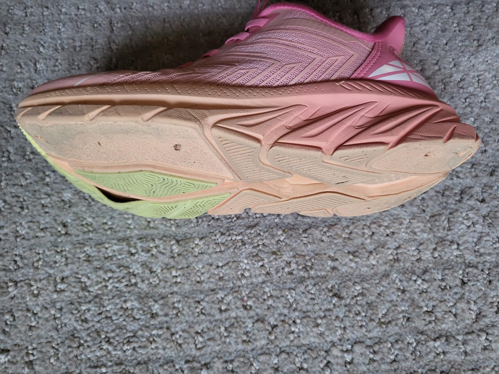 Close-up of slip-on walking sneaker showing breathable mesh upper and elastic lacing system