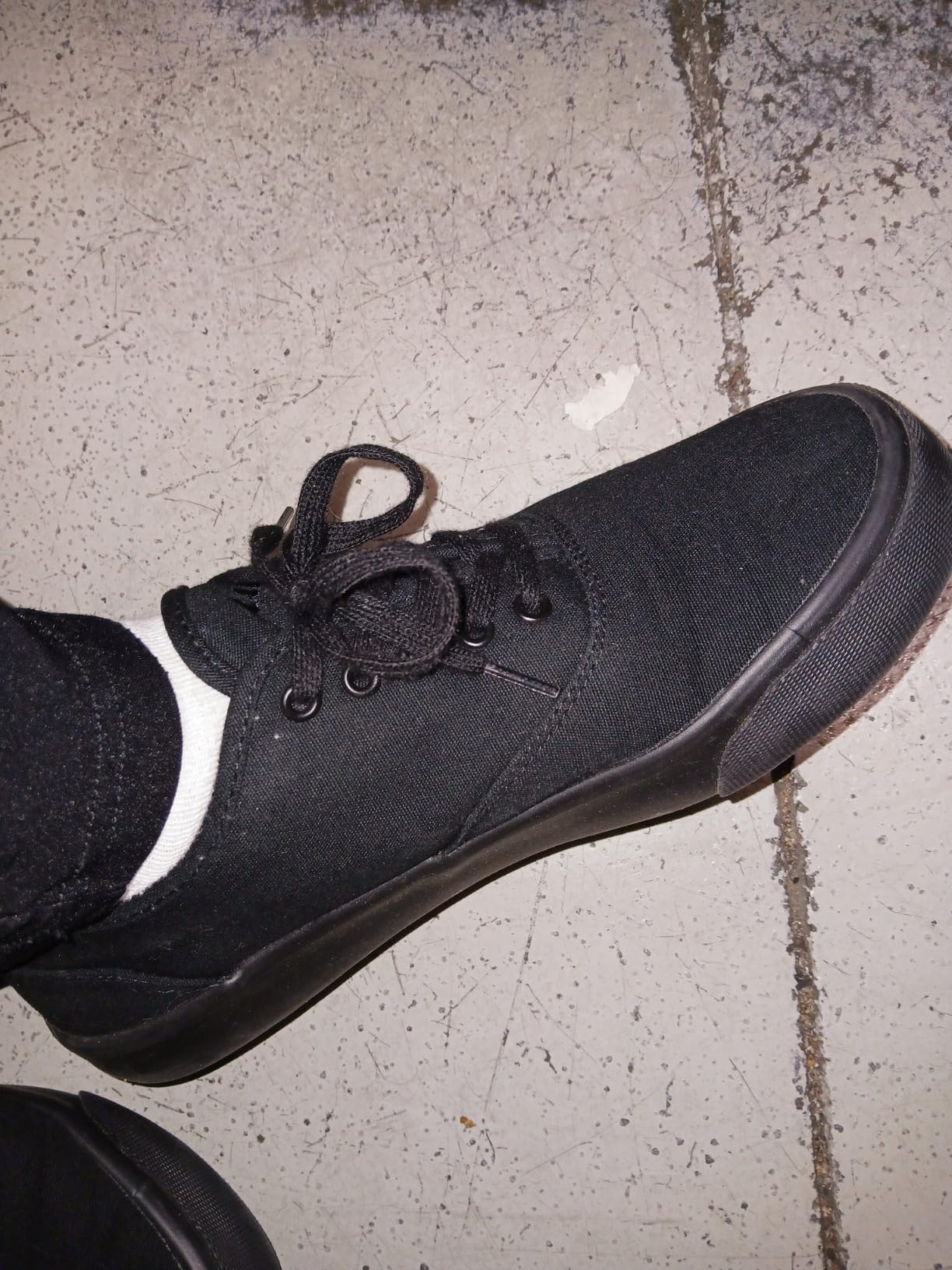 Lugz Lear sneaker showing canvas upper construction and rubber toe cap detail