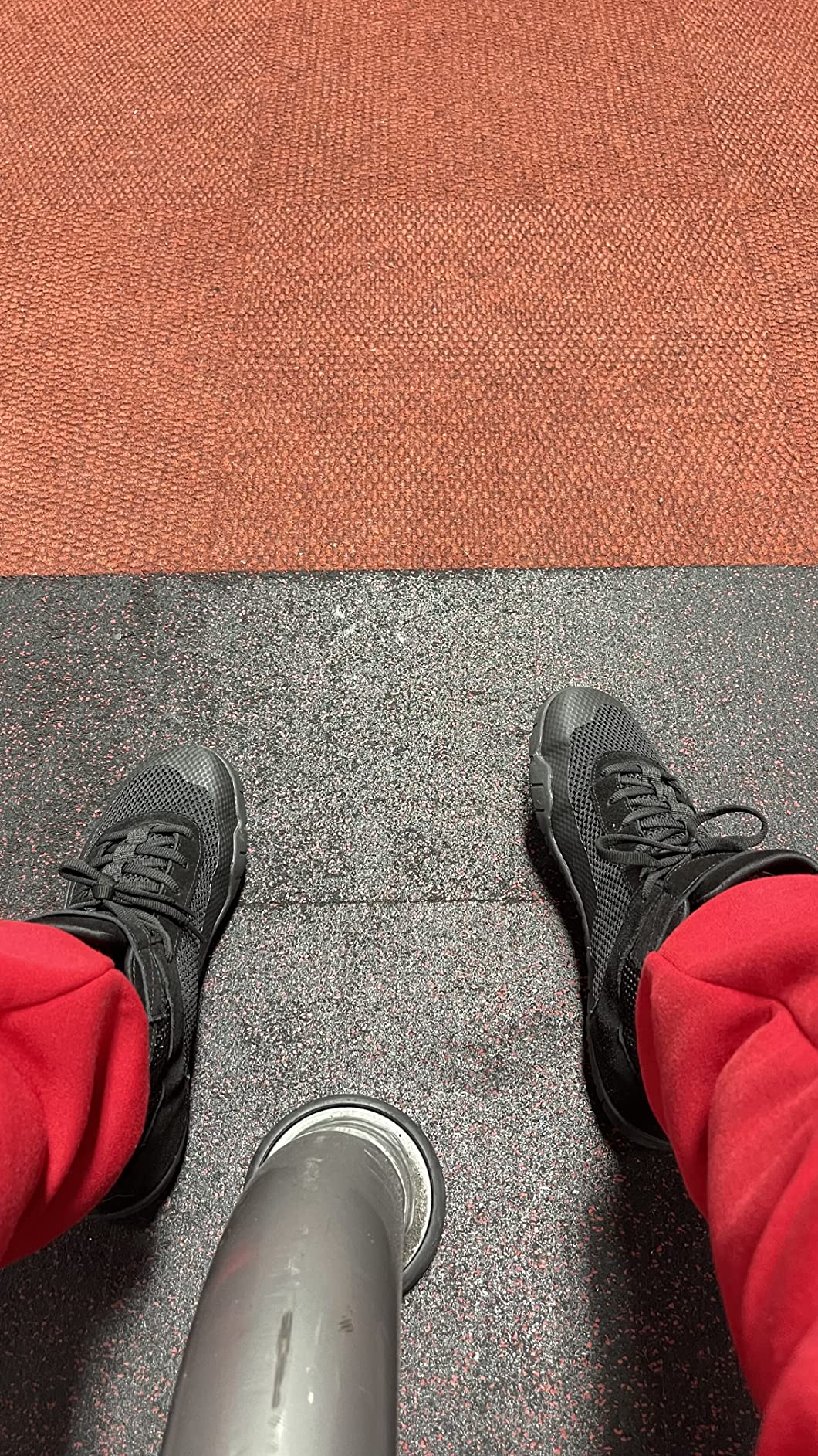 Close-up of wrestling shoe construction showing mesh upper and sole attachment details