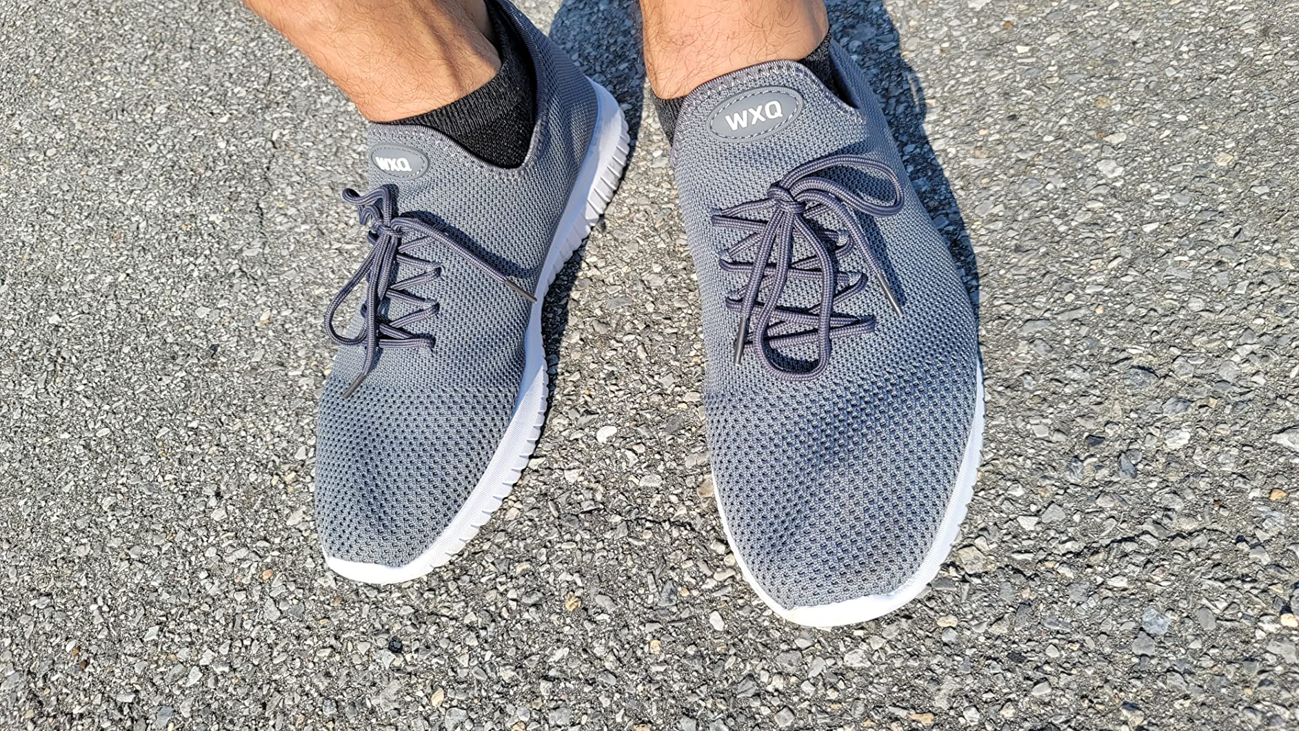 Bottom sole view of WXQ walking shoe showing EVA tread pattern and grip design