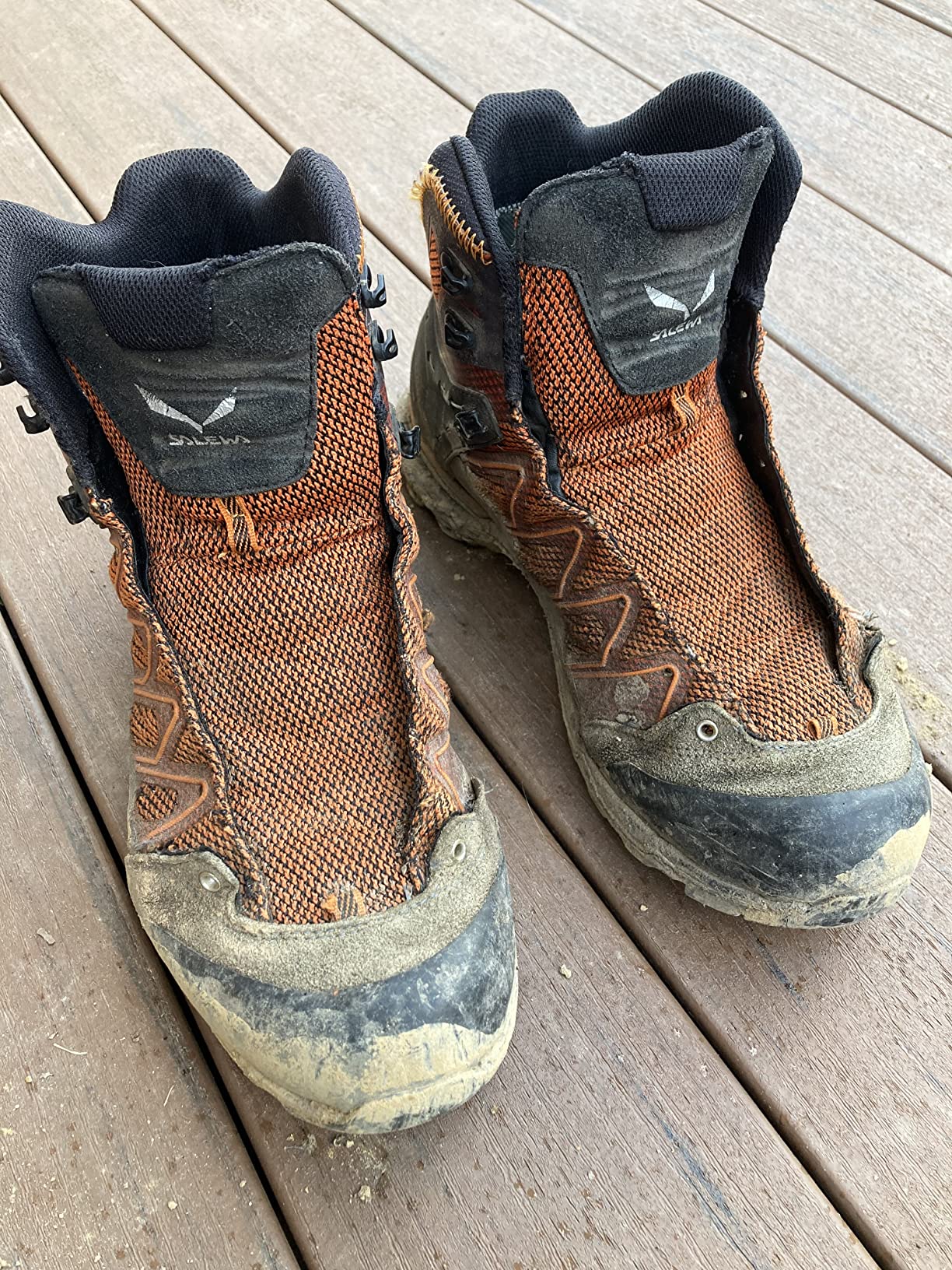 Hiking boots showing wear patterns and material degradation after trail use