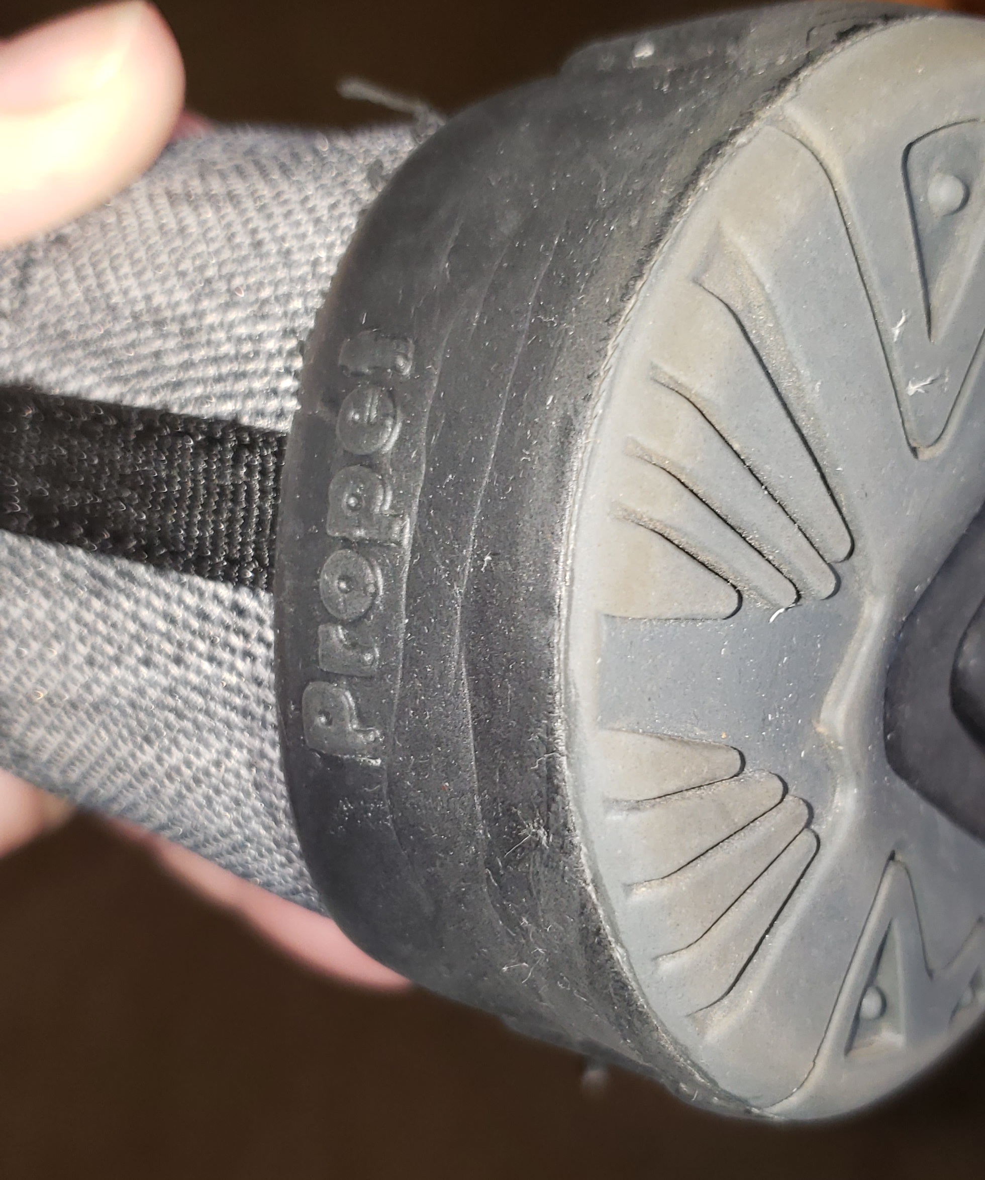 Propét walking shoe showing quality control issues with dirt and pet hair visible in new shoe