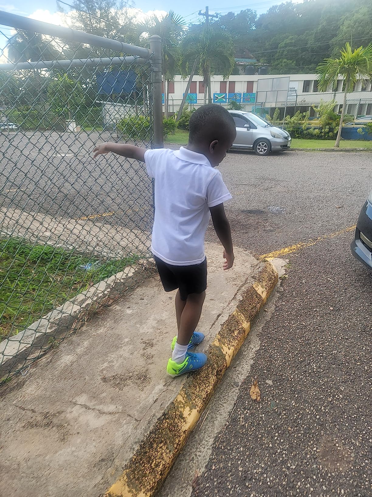 Action shot of DREAM PAIRS soccer cleats during gameplay showing traction on grass field