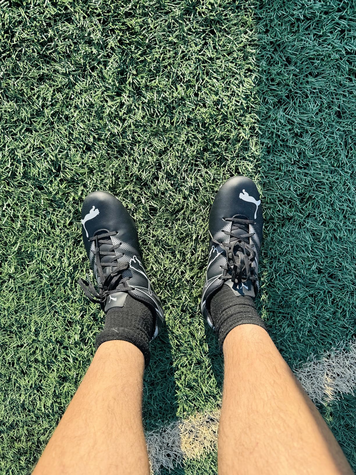 PUMA Attacanto soccer cleats in action showing stud pattern and field performance during play