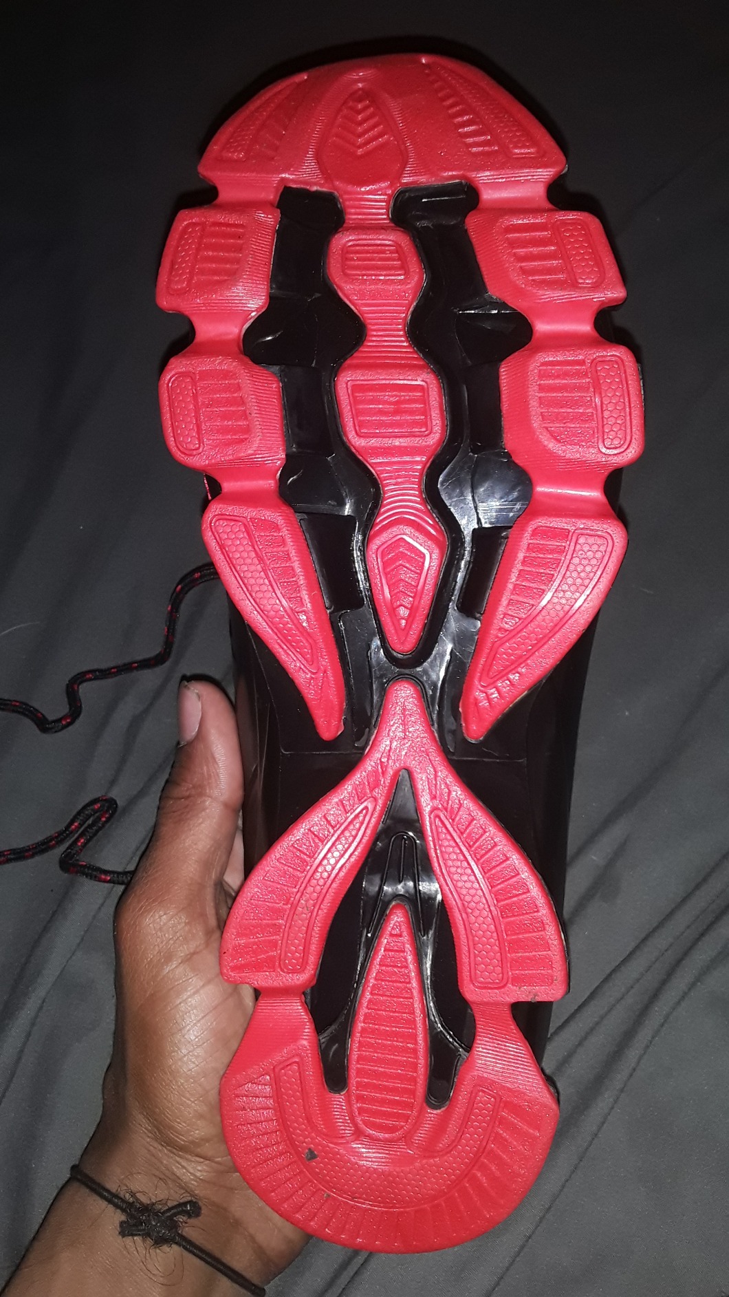 Bottom view of SKDOIUL shoe sole showing traction pattern and durability after testing period