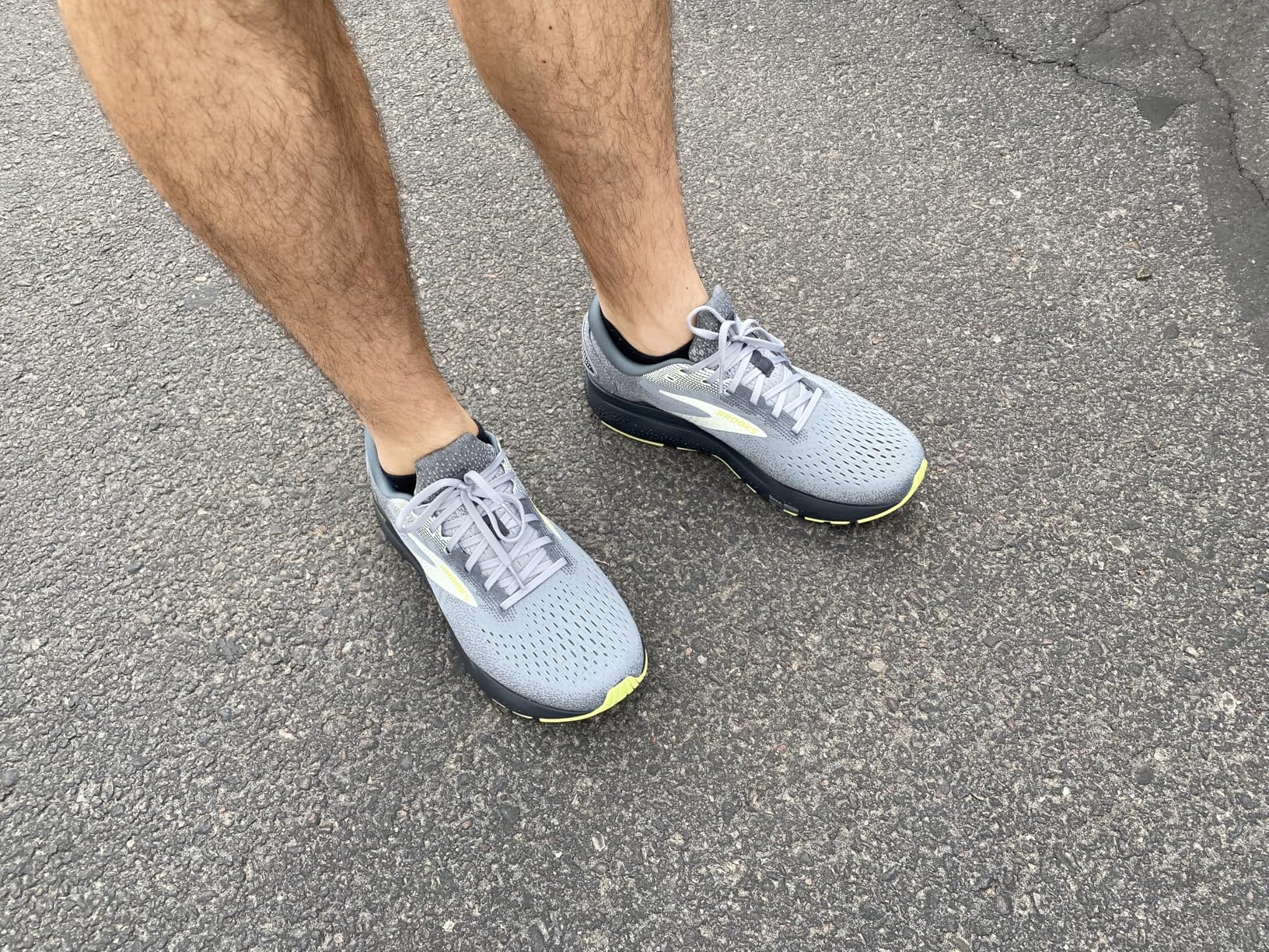 Brooks Ghost 16 grey and lime colorway showing 3D Fit Print upper technology and RoadTack rubber outsole