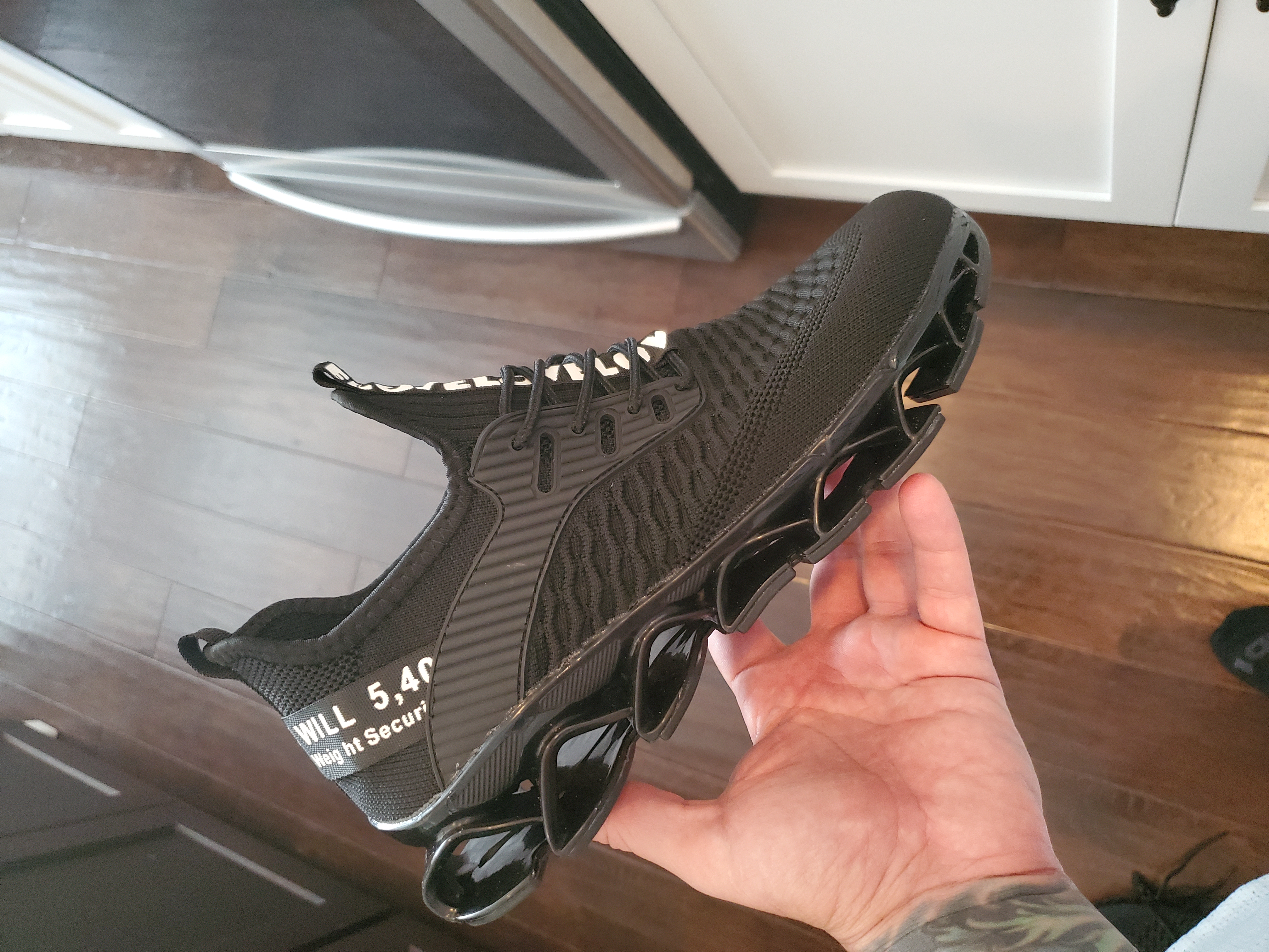 Men's Running Shoes showing breathable upper material and non-slip sole features