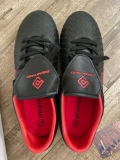 DREAM PAIRS cleats showing real world usage by youth soccer players