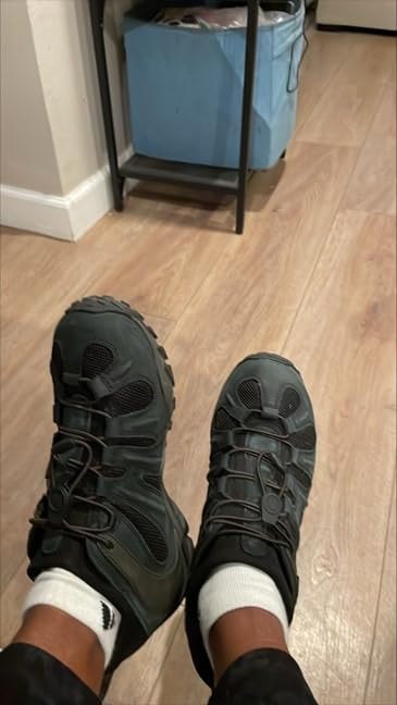 Merrell Men's Chameleon 8 Stretch hiking shoe brown colorway showing elastic lacing system and rugged construction