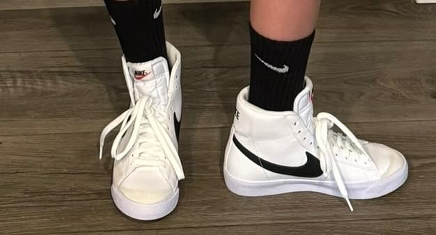 Comparison view of Nike Kids Blazer Mid 77 showing classic design elements and Nike branding details