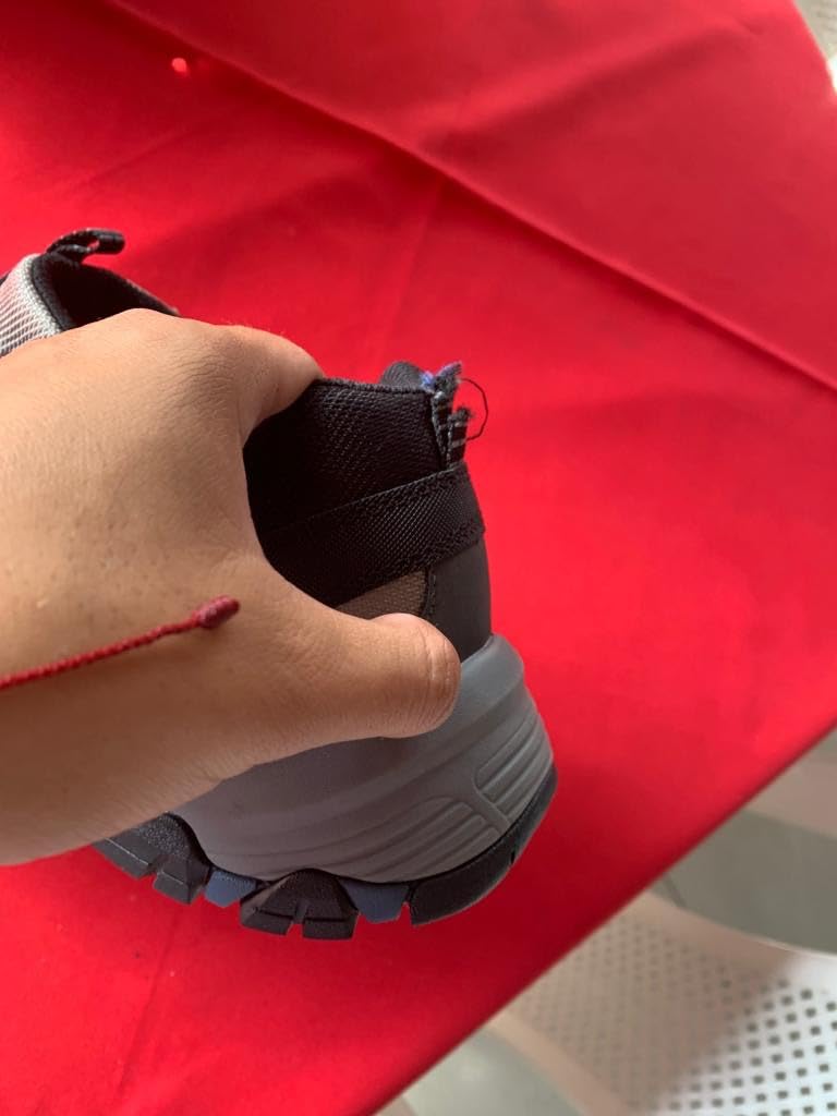 Hiking trail action shot showing Skechers Selmen-Enago grip and traction on rocky terrain